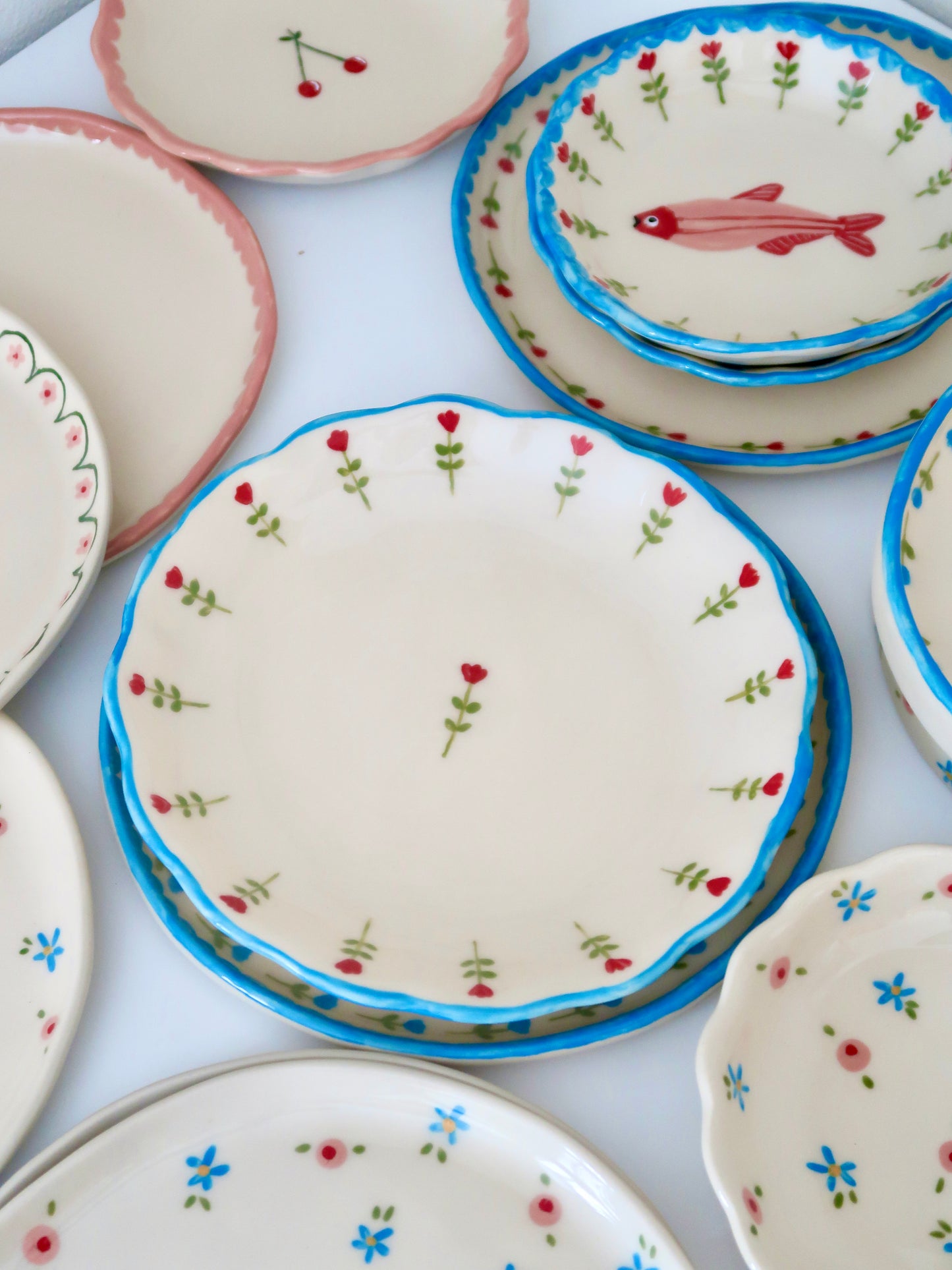 Scalloped plate with red flowers