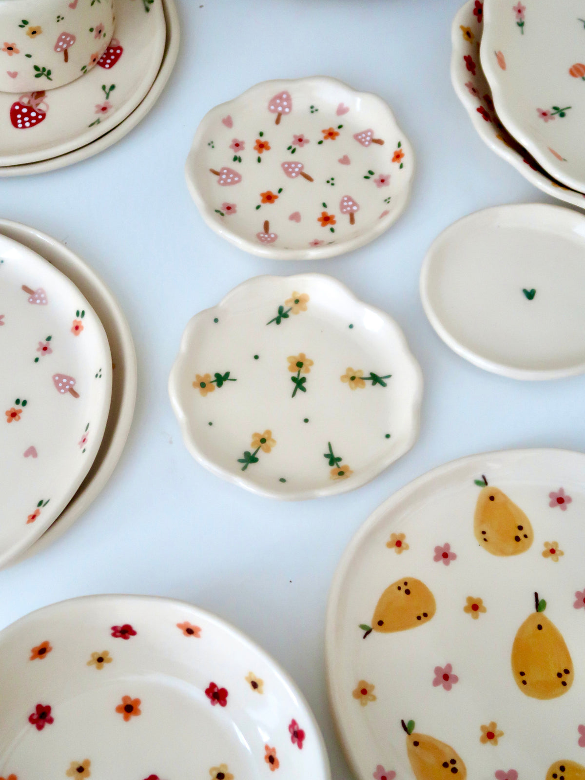 Scalloped ring dish with yellow flowers and green dots