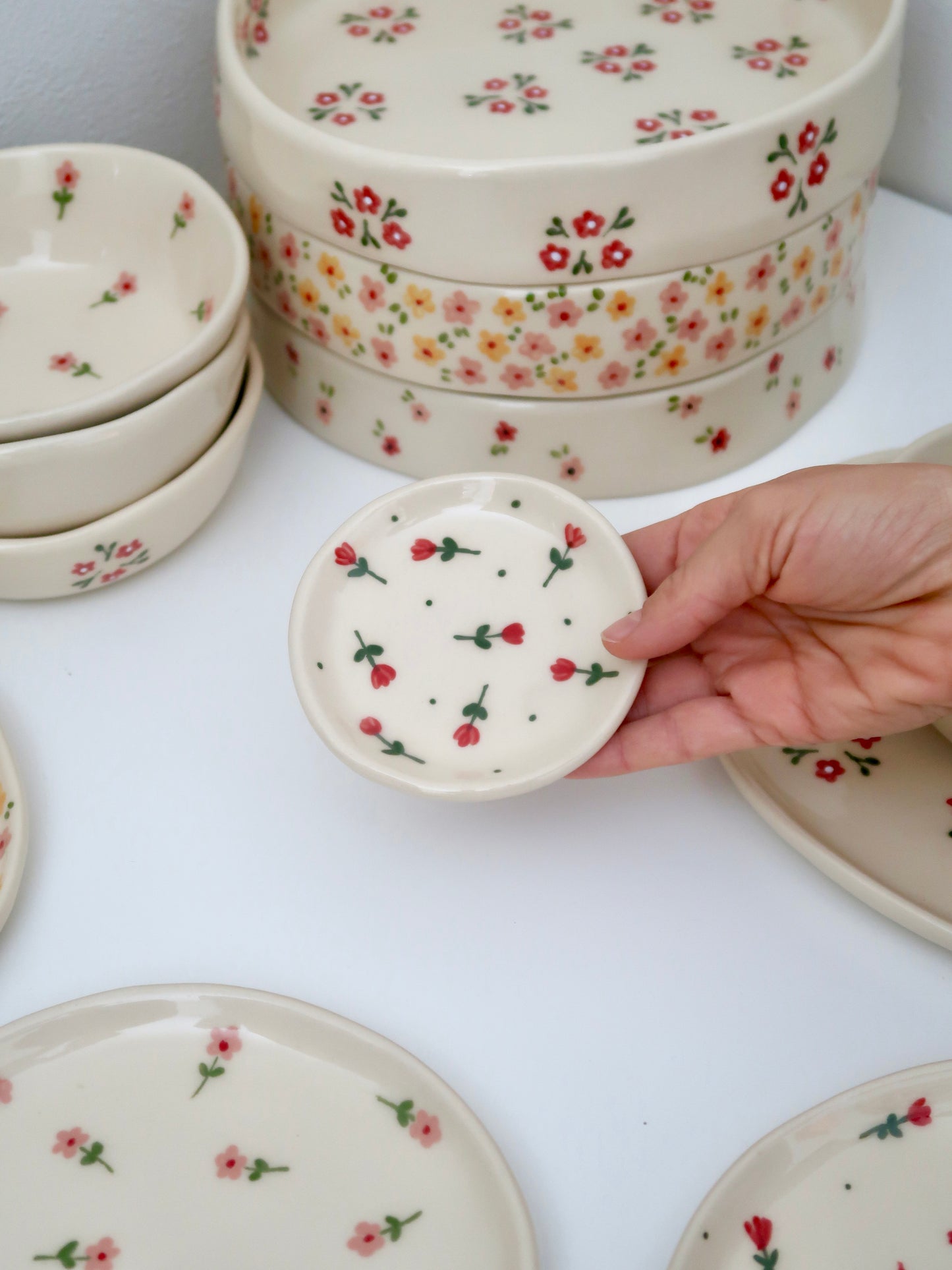 Ring dish with red flowers and green dots
