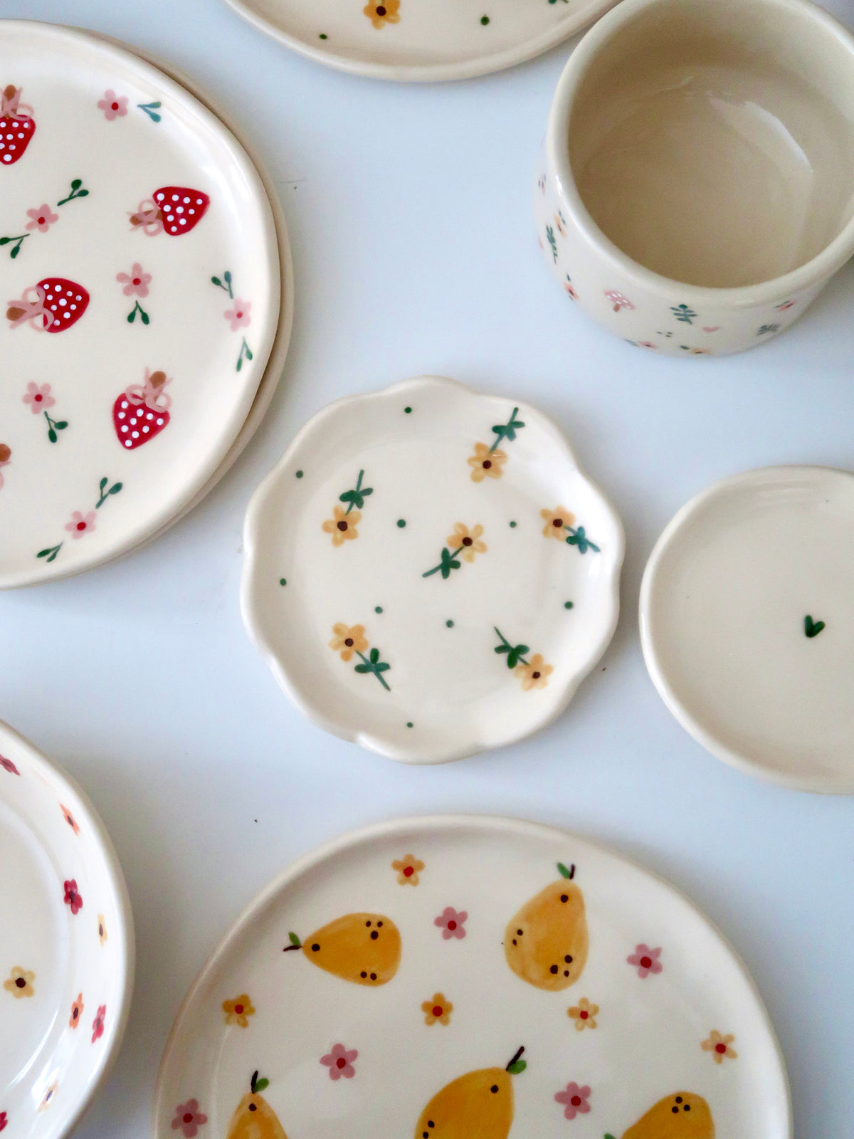 Scalloped ring dish with yellow flowers and green dots