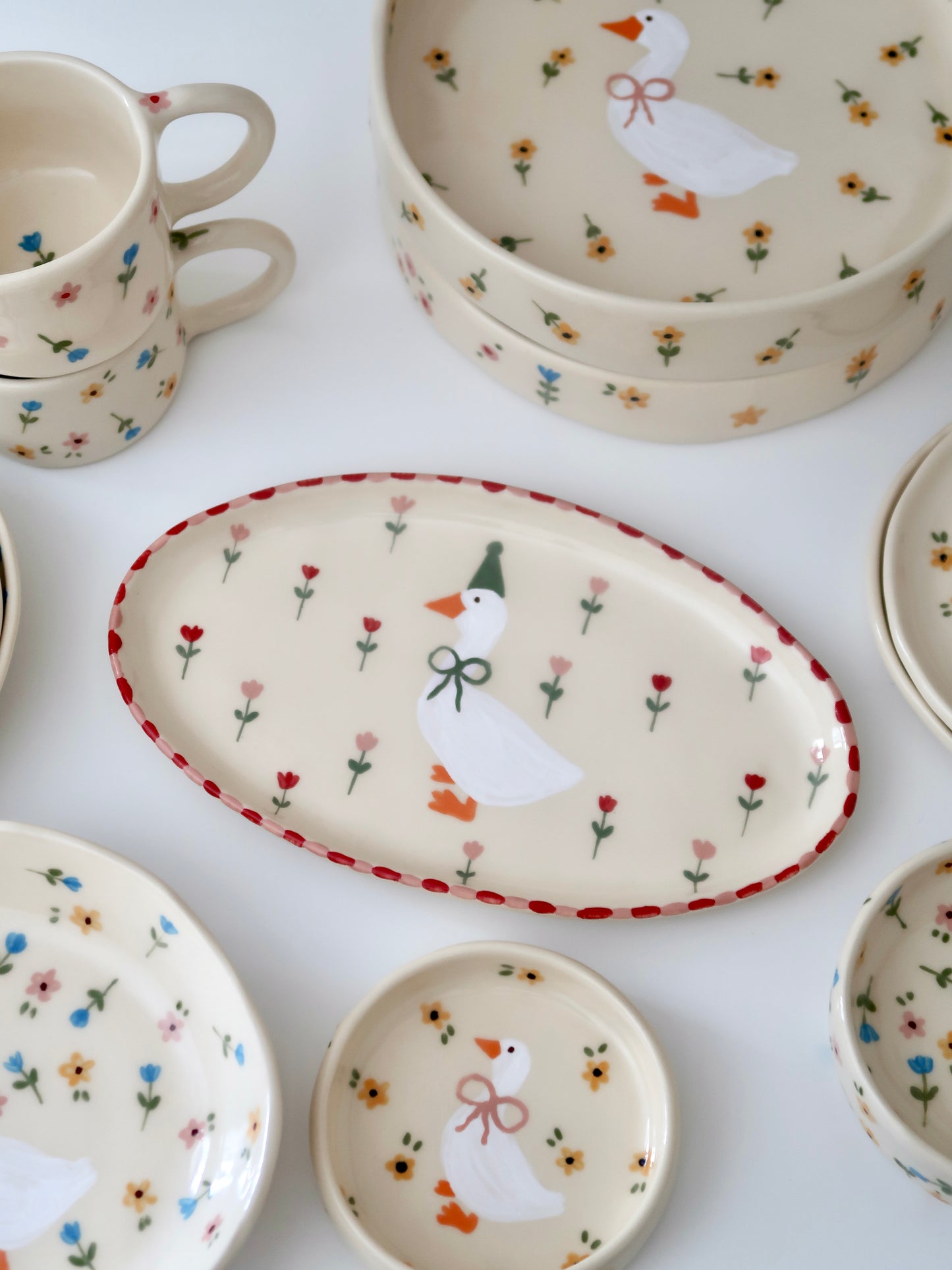 Platter with a duck, red and pink flowers