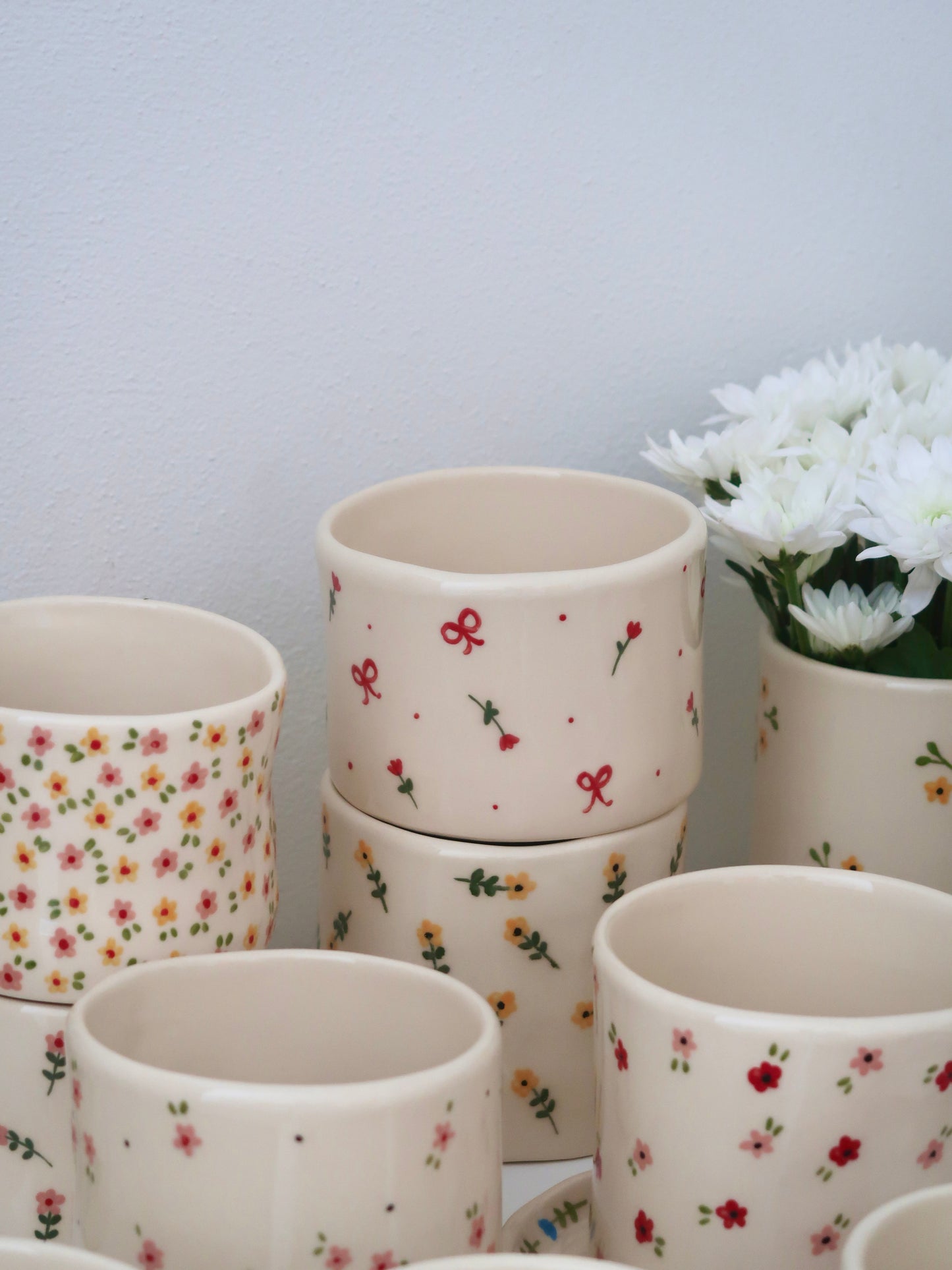 Vase with red flowers and bows