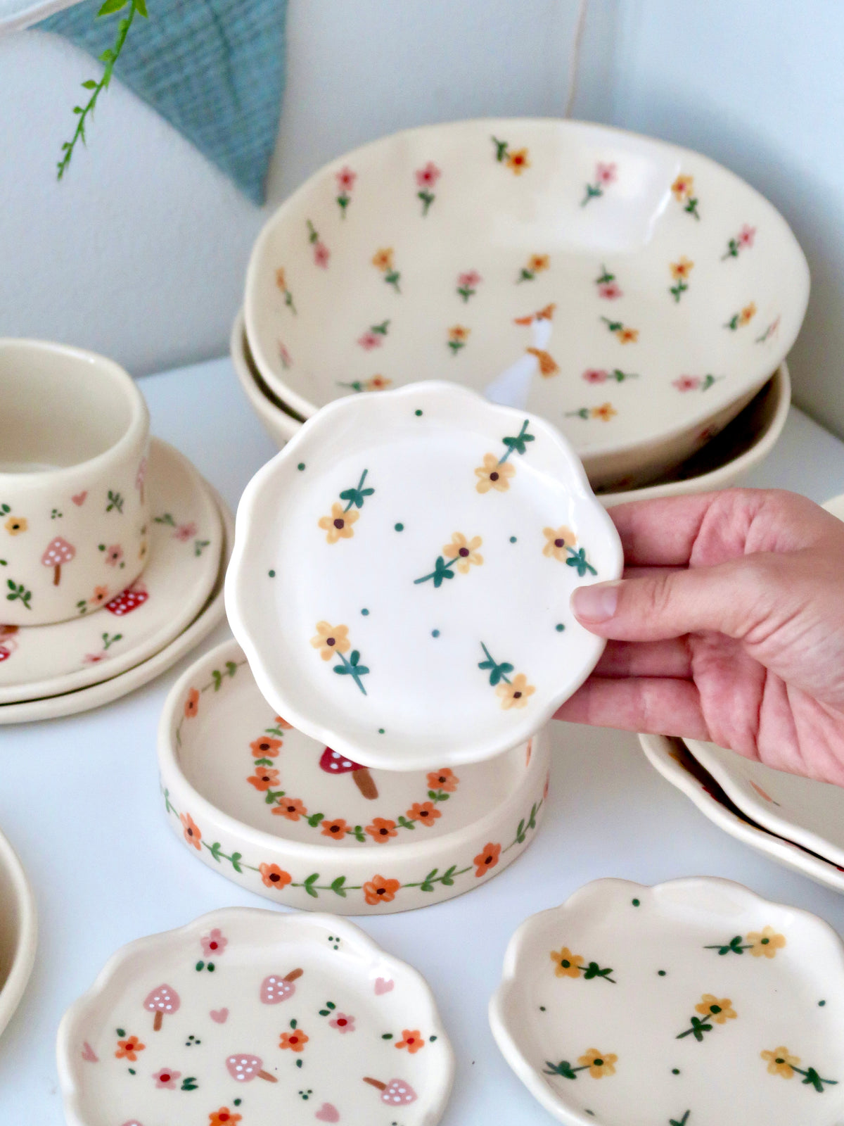 Scalloped ring dish with yellow flowers and green dots