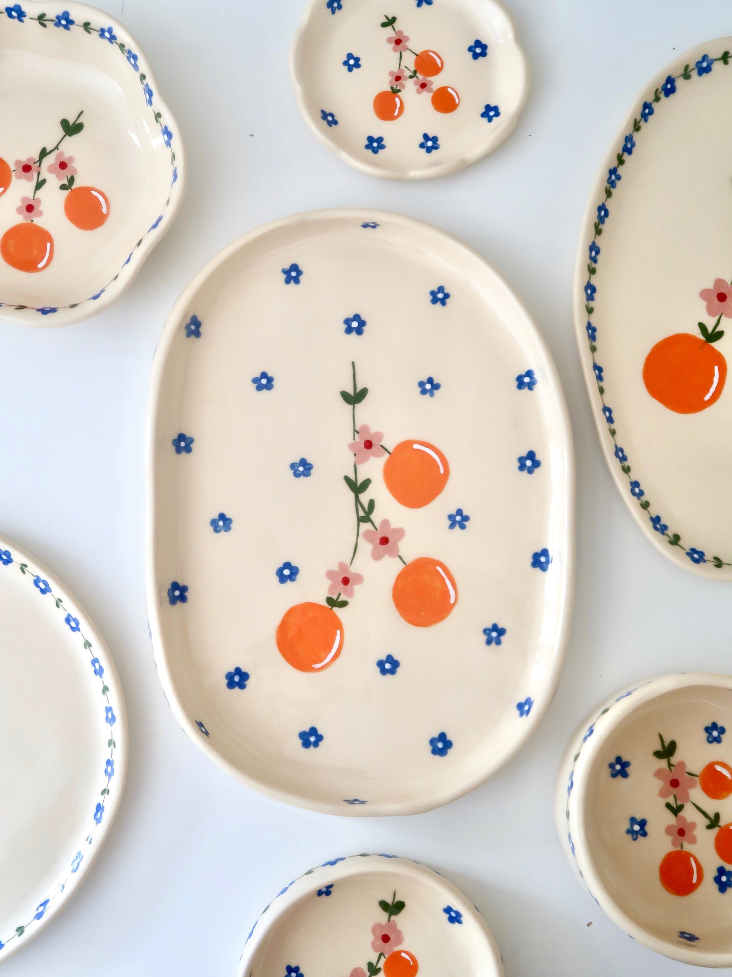 Platter with oranges and pink flowers