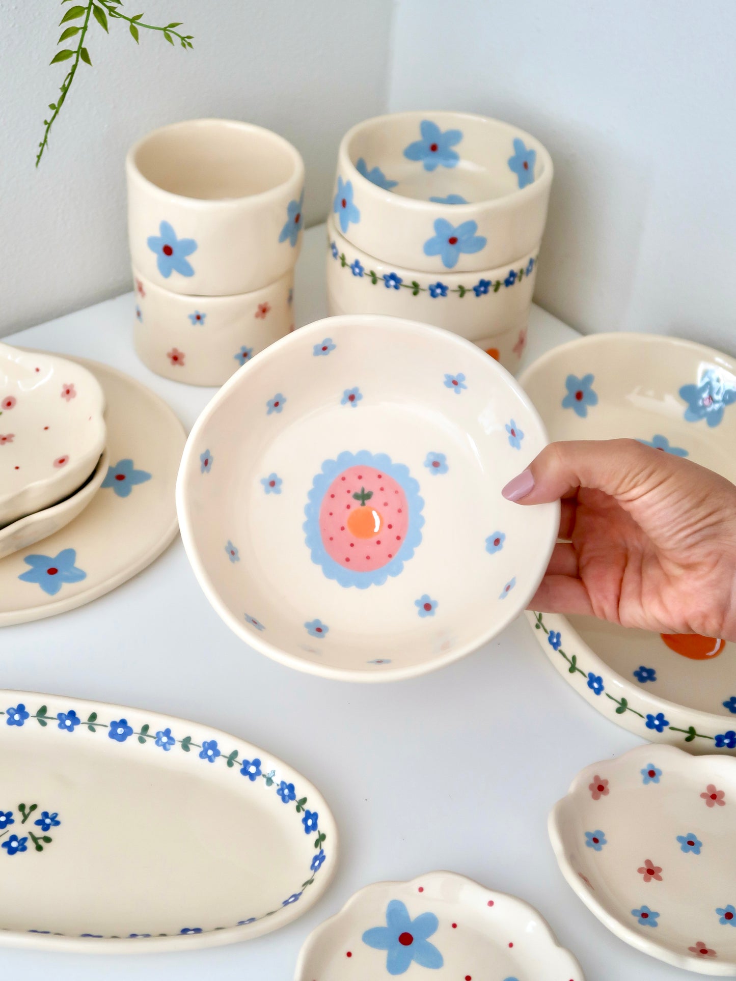 Bowl with orange and blue flowers