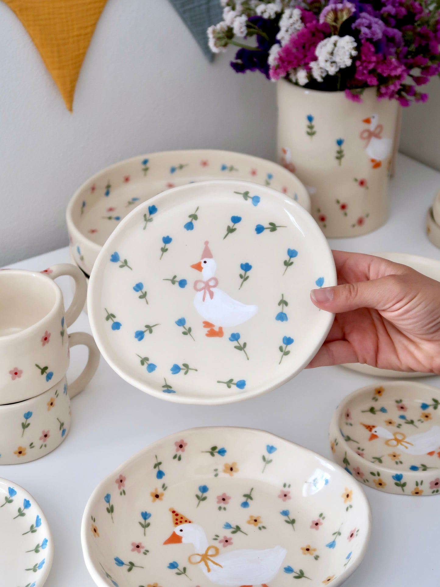 Breakfast/dessert plate with a duck with blue flowers
