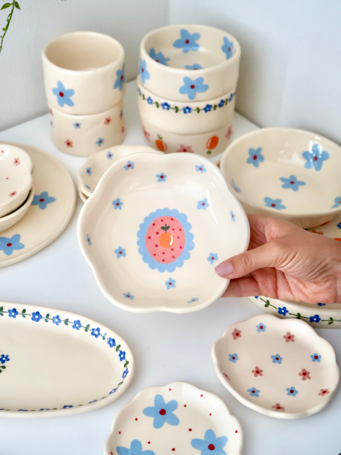 Scalloped bowl with orange and blue flowers