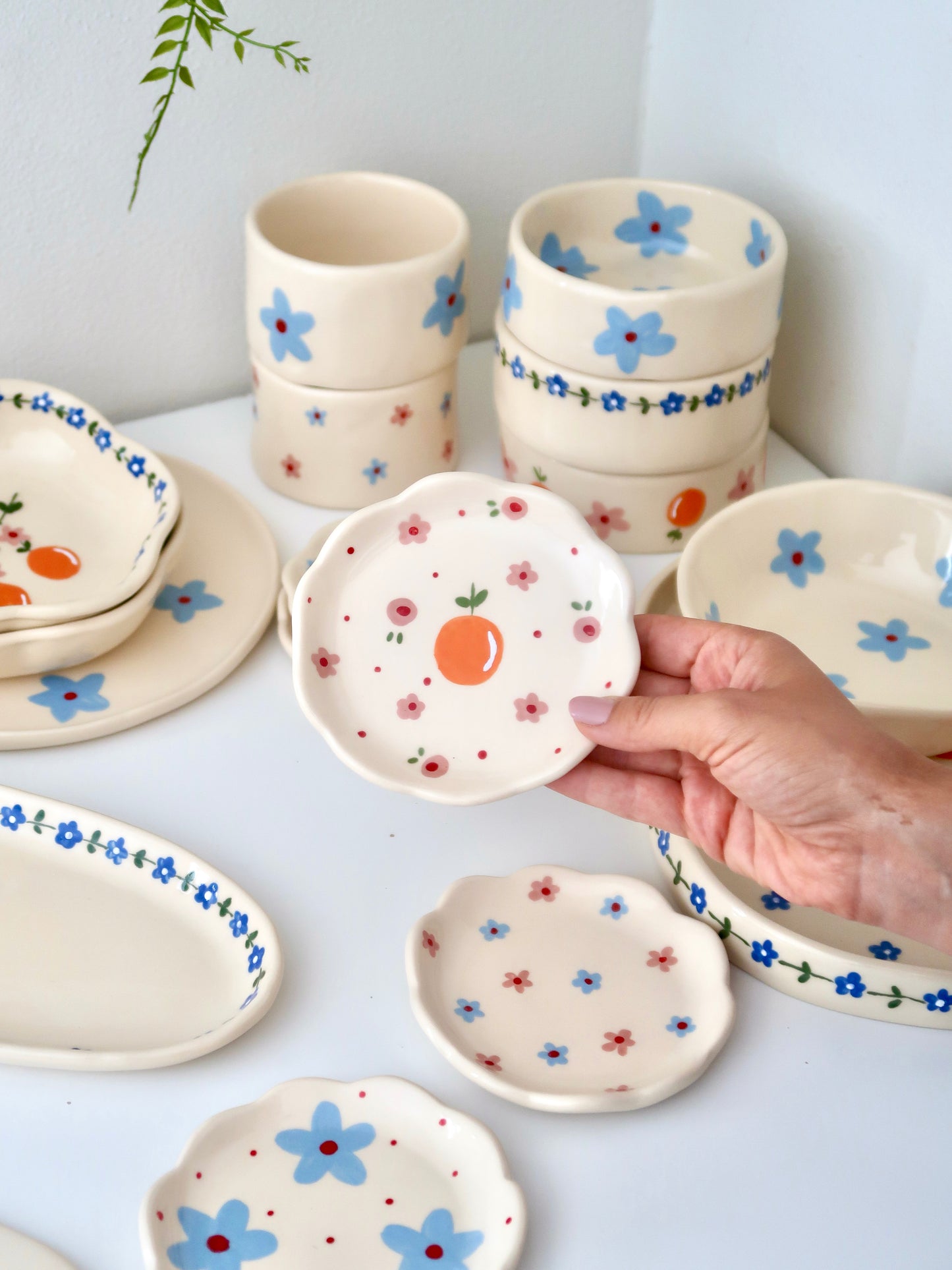Scalloped ring dish with orange and pink flowers