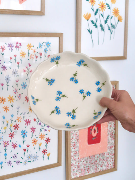 Scalloped plate with blue flowers
