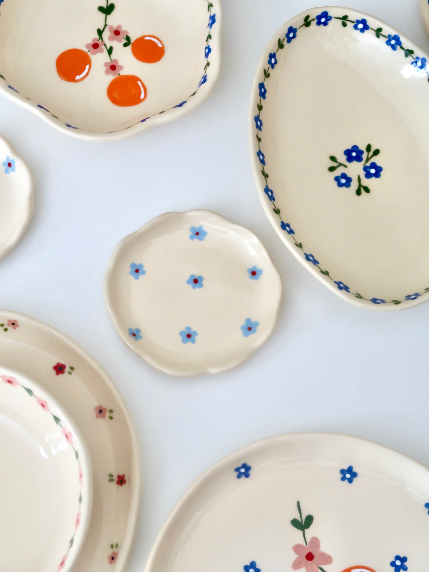 Scalloped ring dish with blue flowers