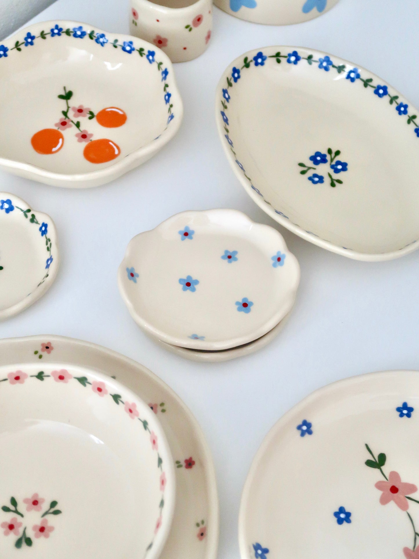 Scalloped ring dish with blue flowers