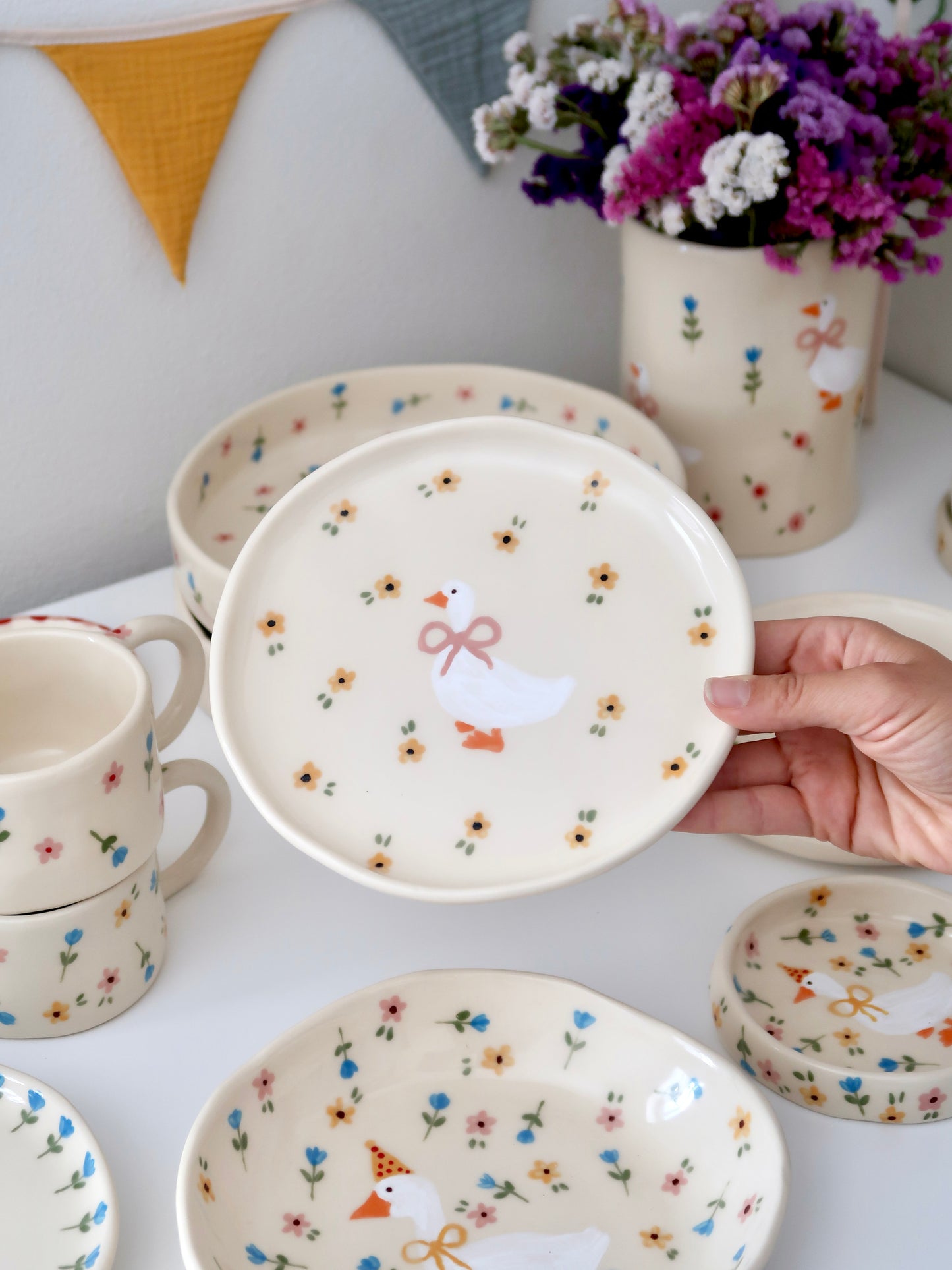 Breakfast/dessert plate with a duck and yellow flowers
