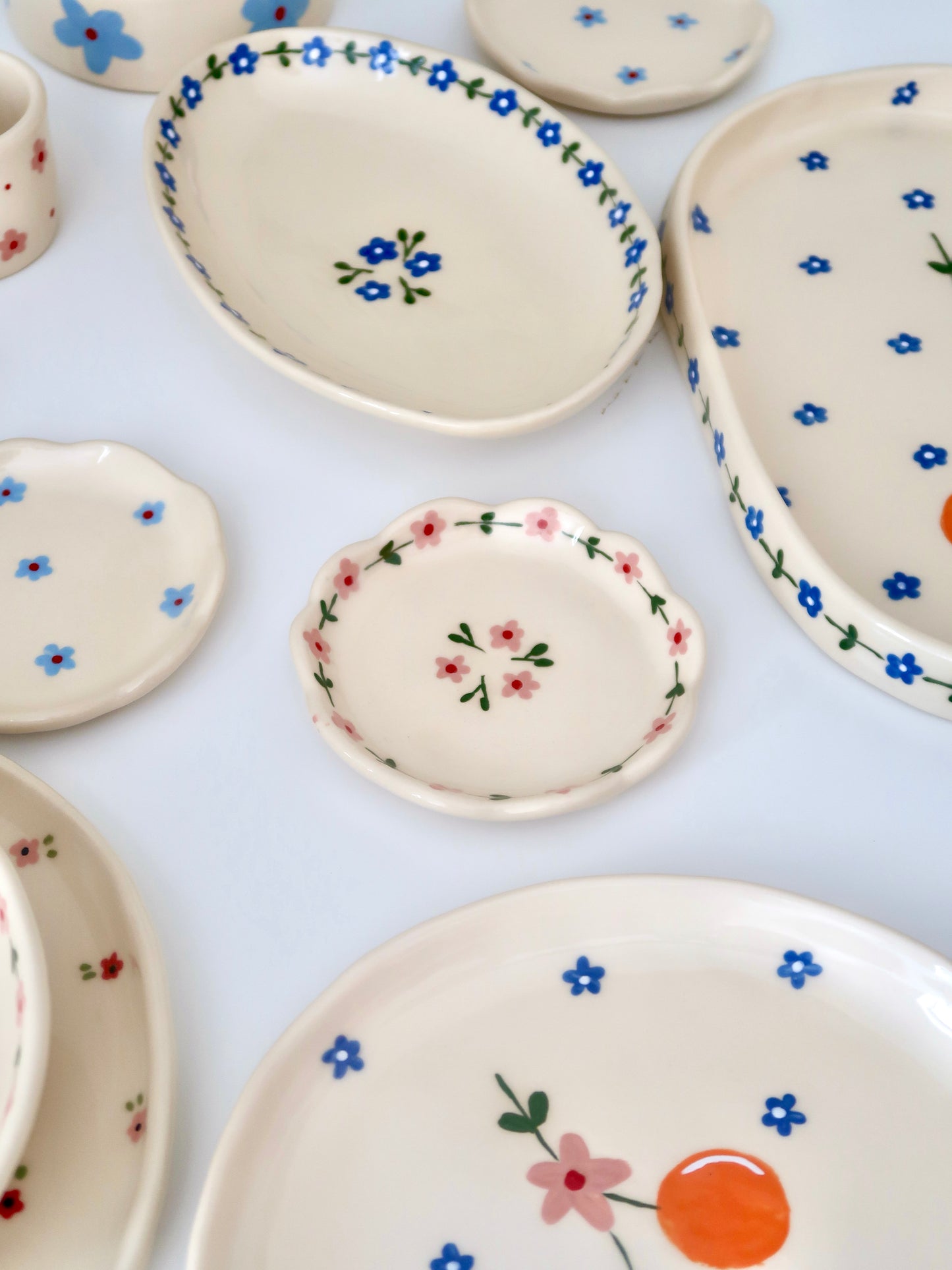 Scalloped ring dish with pink flowers
