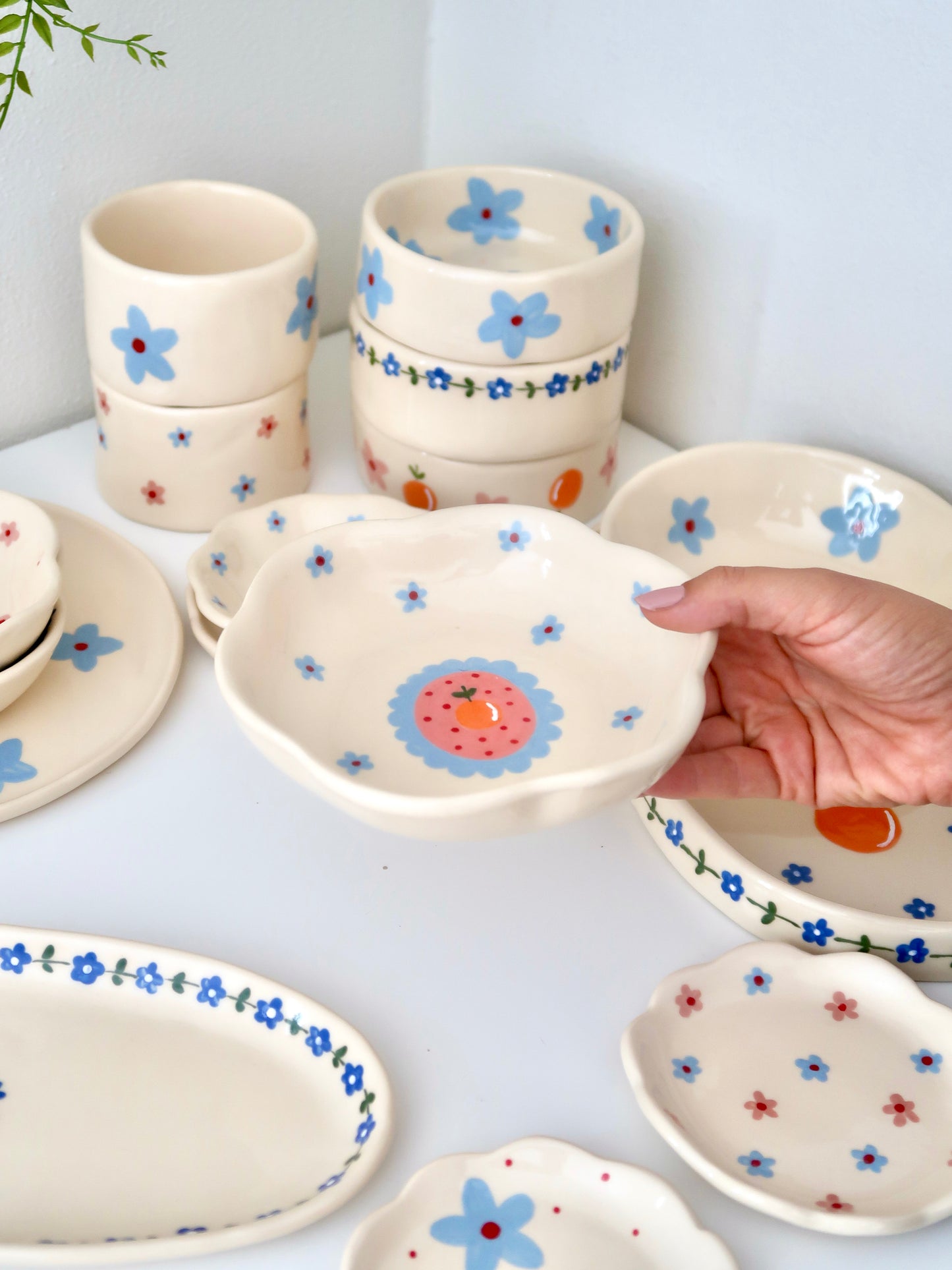 Scalloped bowl with orange and blue flowers