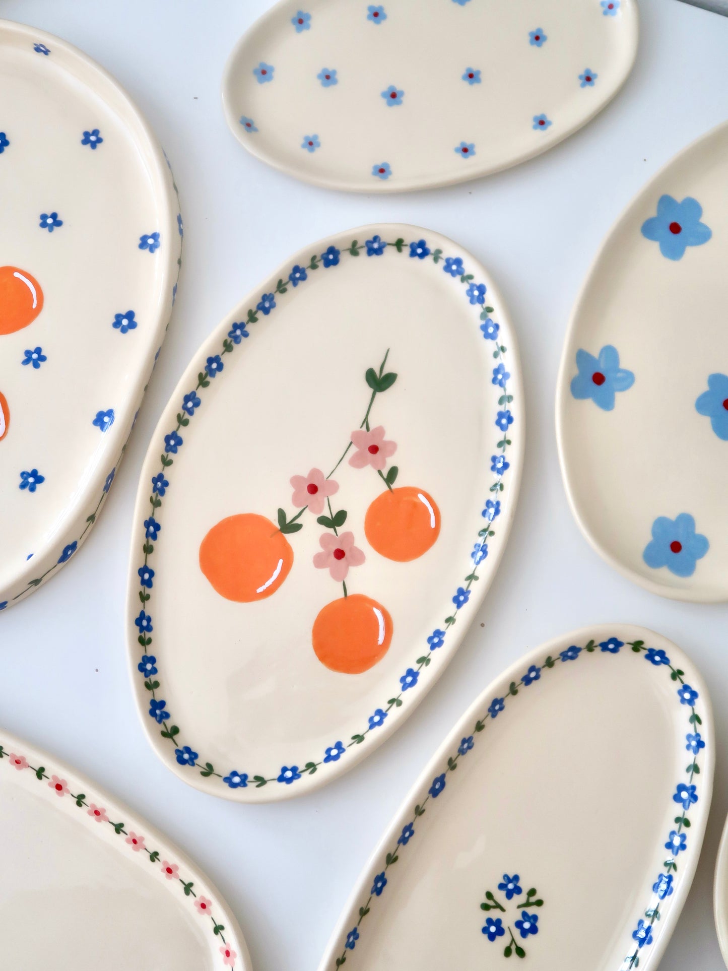 Platter with oranges and blue flowers