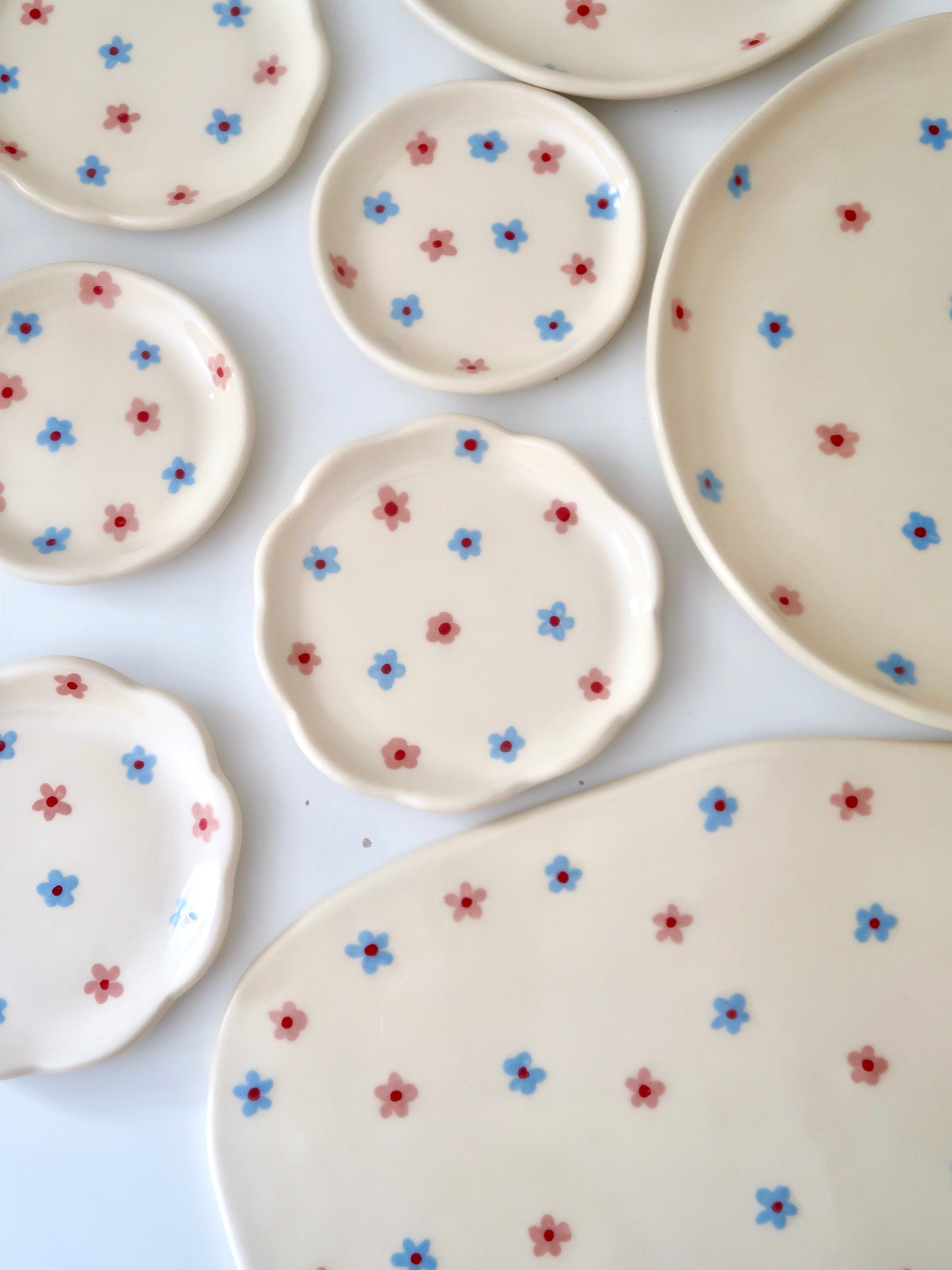 Scalloped ring dish with pink and blue flowers