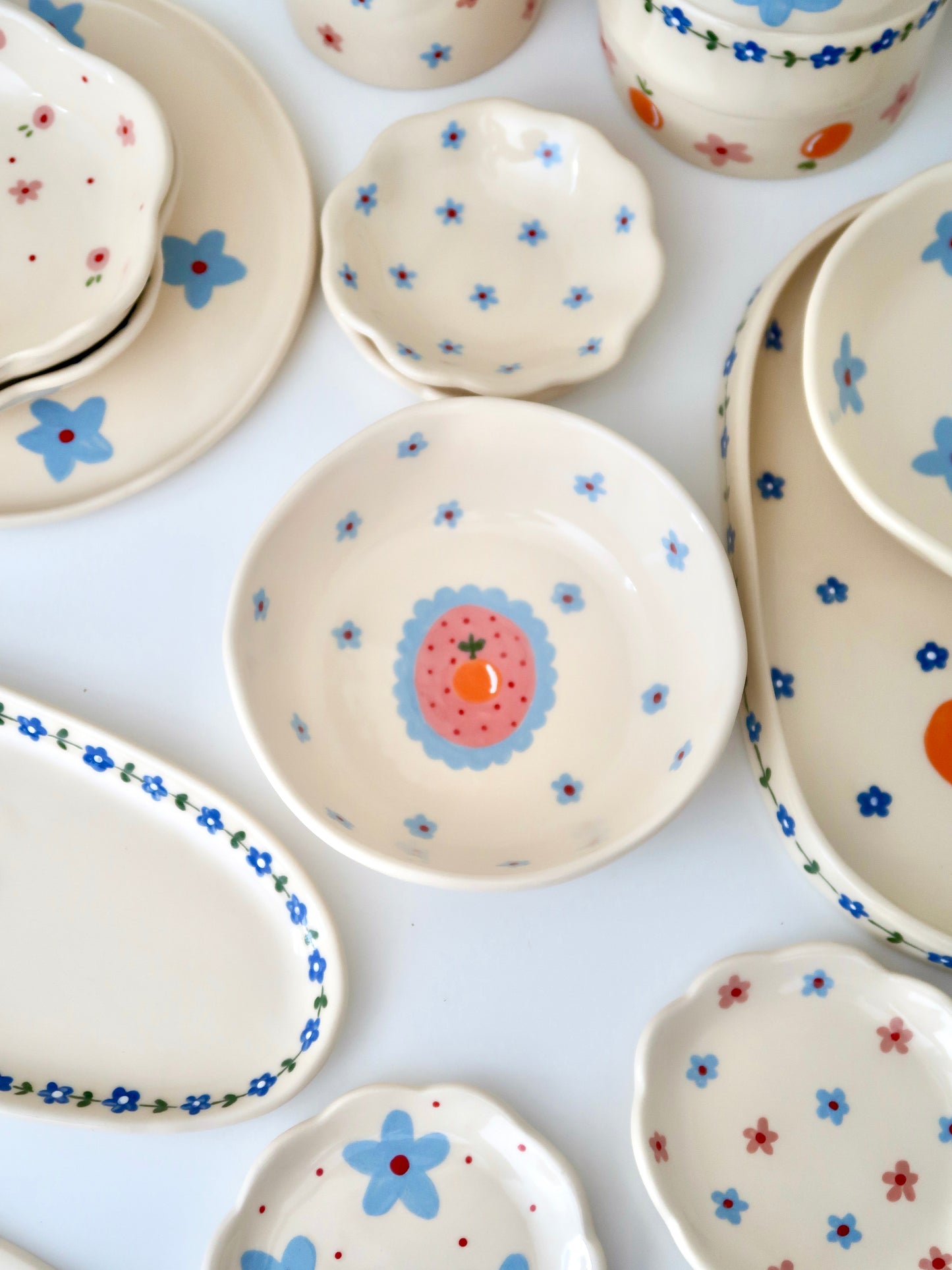 Bowl with orange and blue flowers