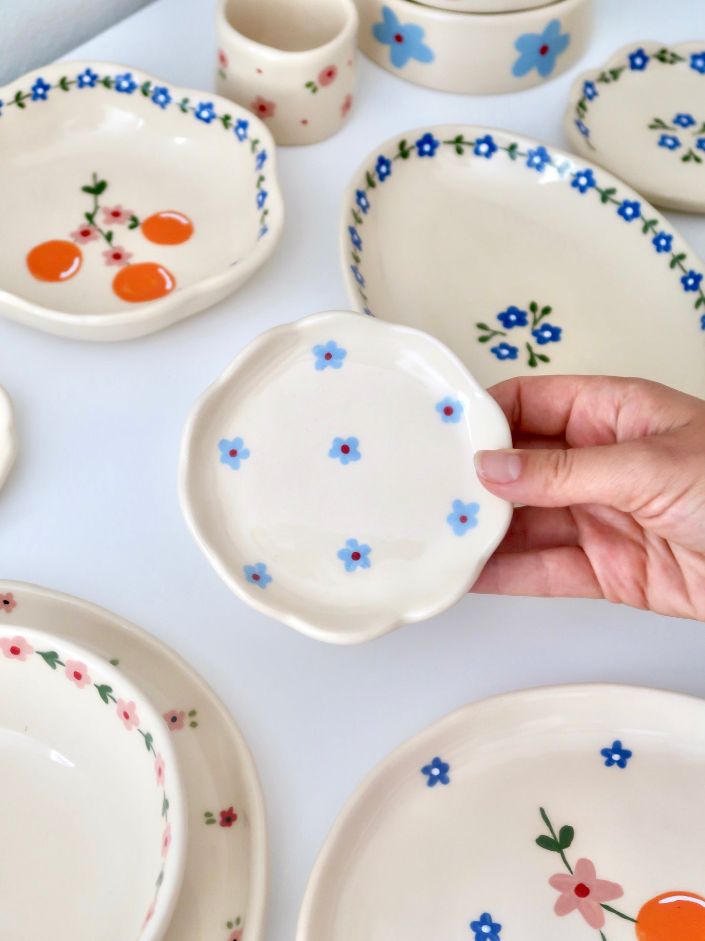 Scalloped ring dish with blue flowers