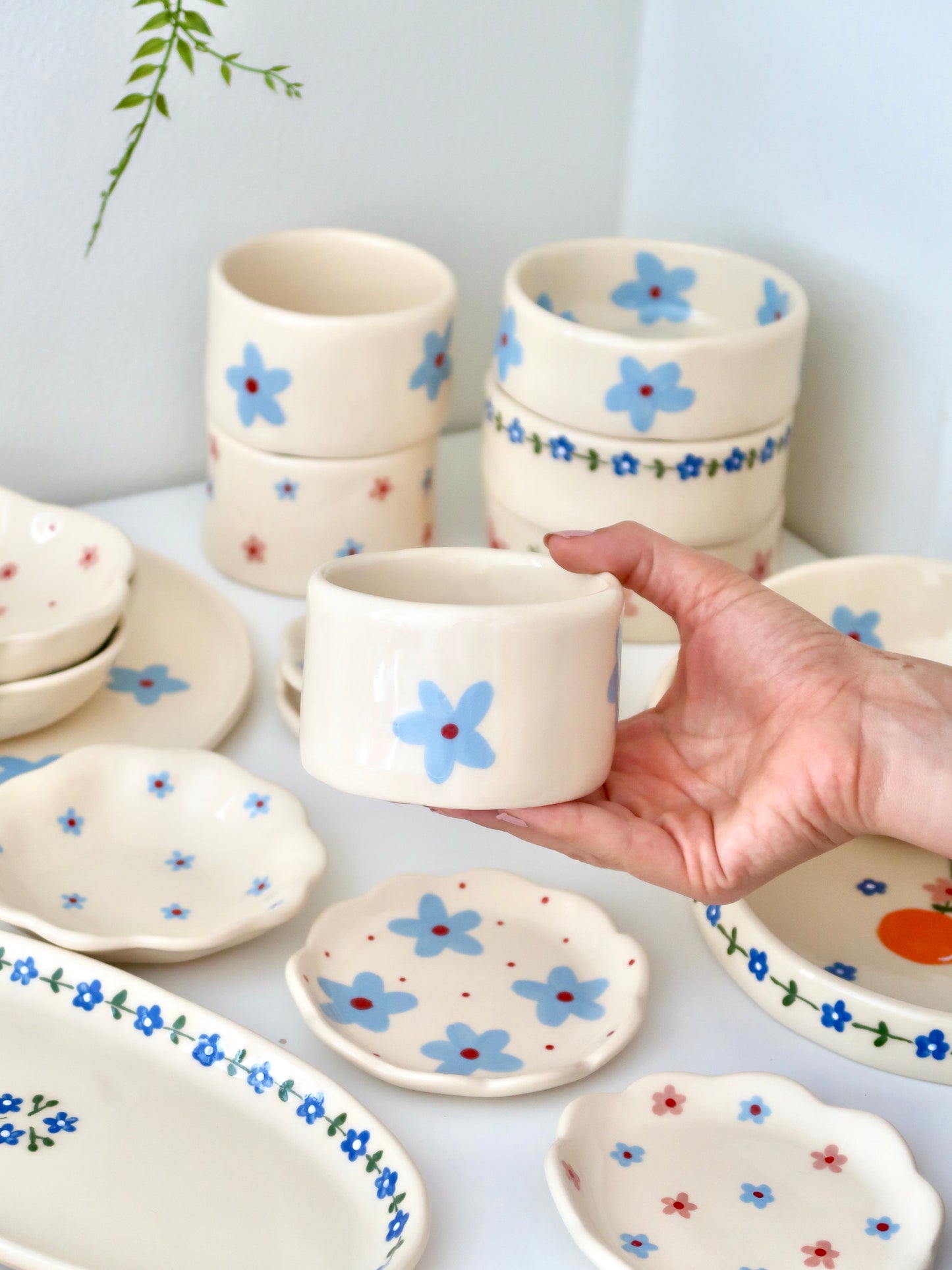 Small vase/ cup with blue flowers⁠