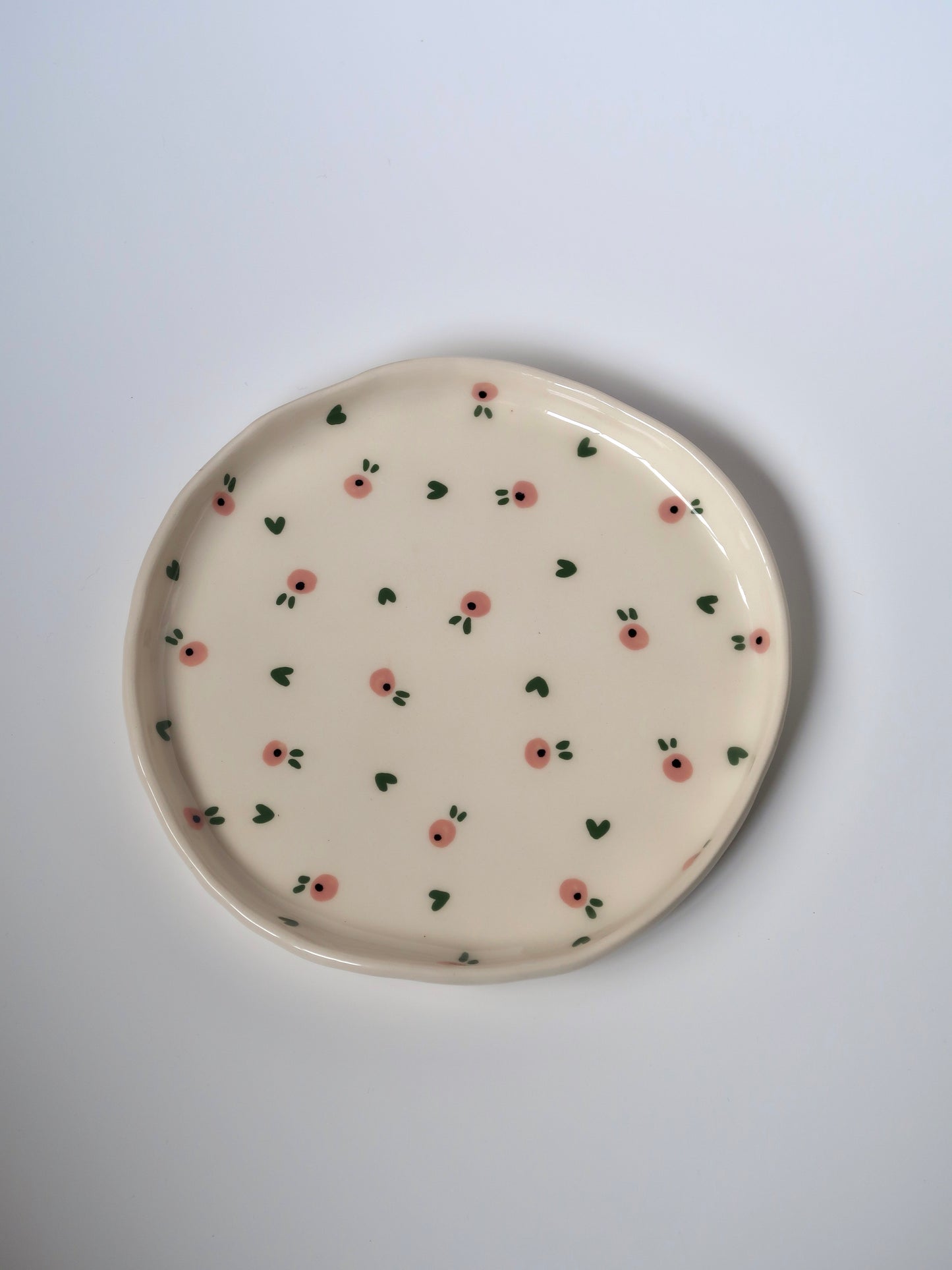 Plate with pink flowers and green hearts