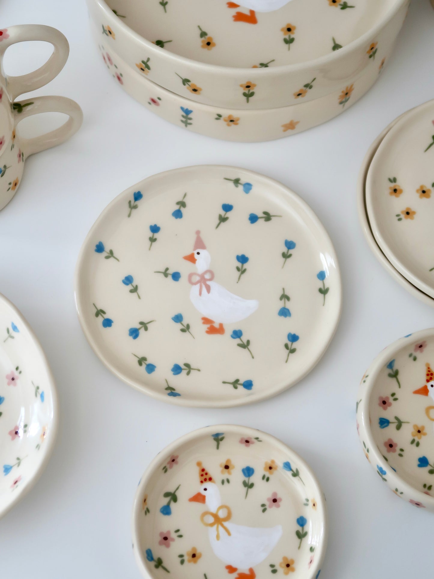 Breakfast/dessert plate with a duck with blue flowers