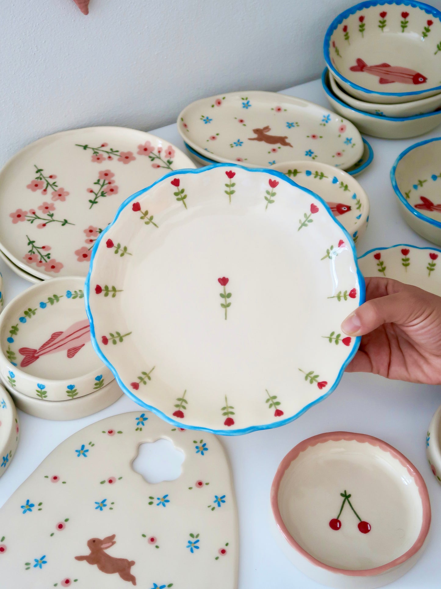 Scalloped plate with red flowers