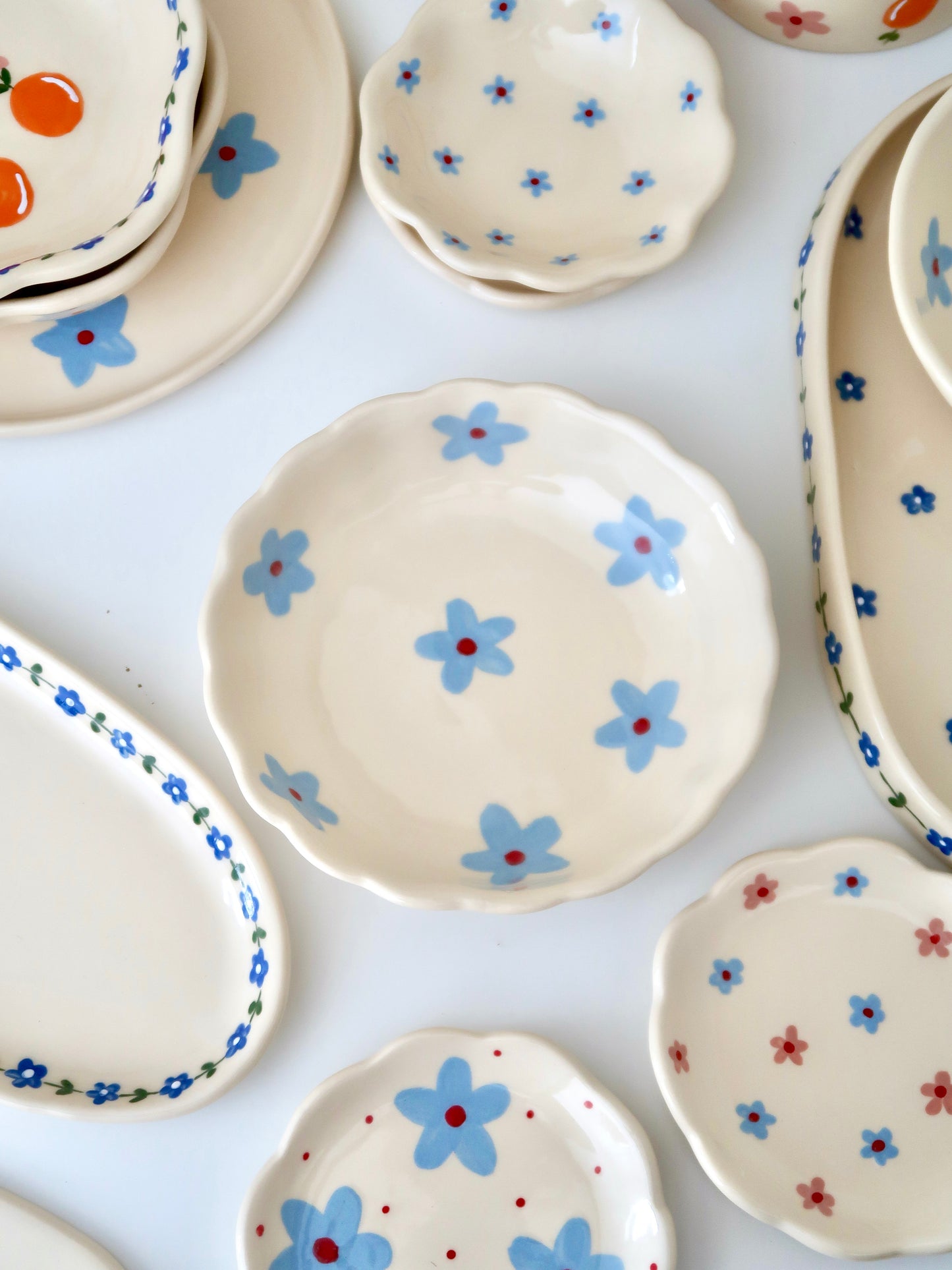 Scalloped bowl with blue flowers flowers
