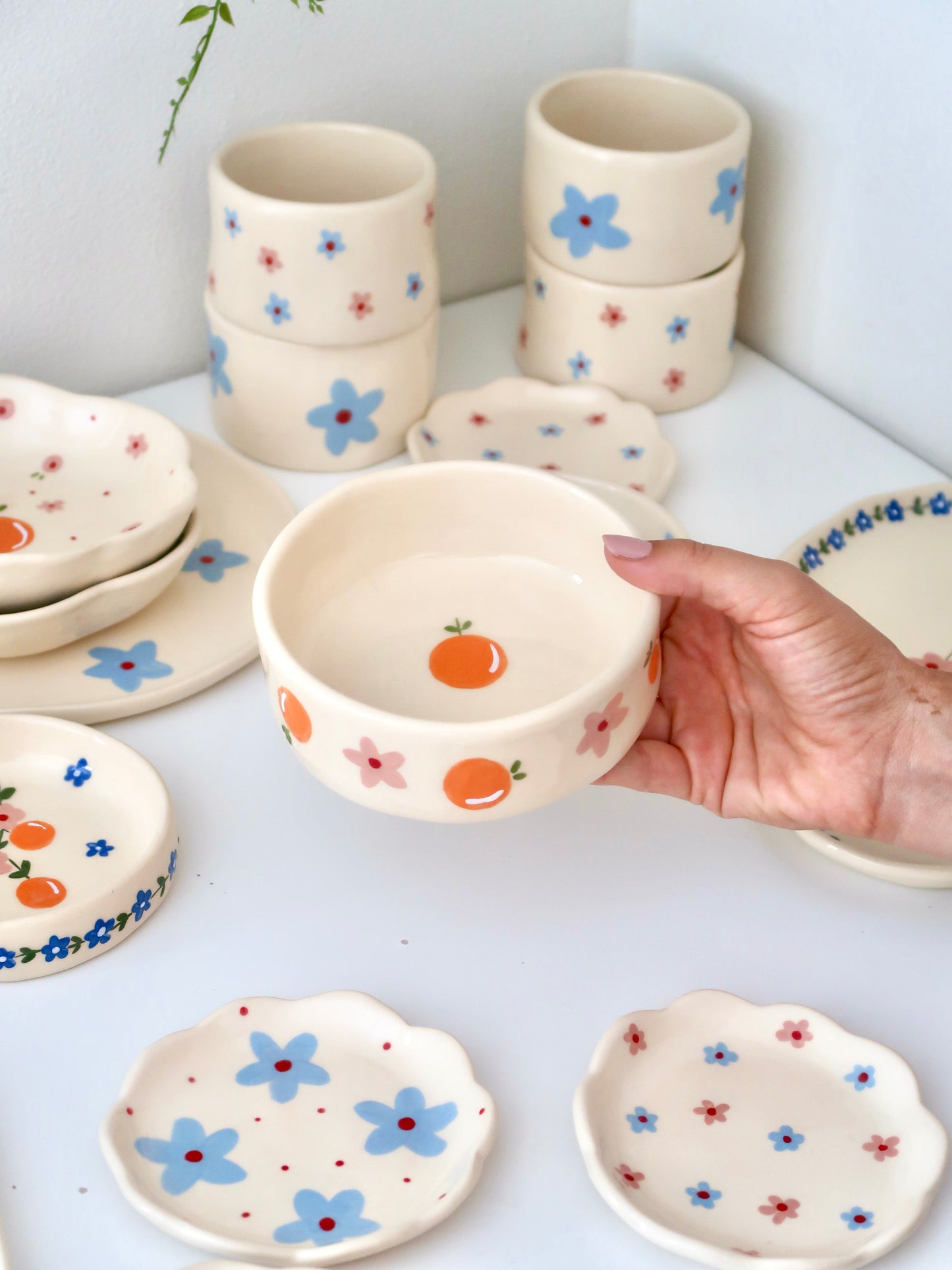 Bowl with oranges and blue flowers