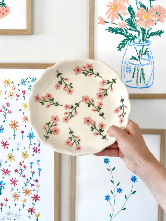 Scalloped plate with pink flowers