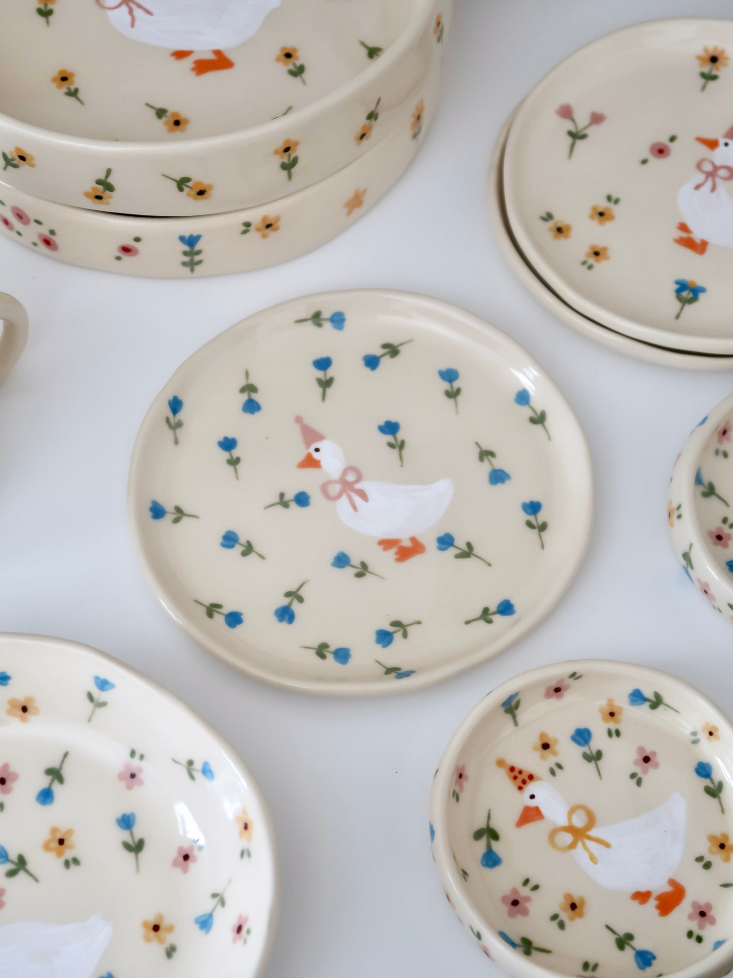 Breakfast/dessert plate with a duck with blue flowers