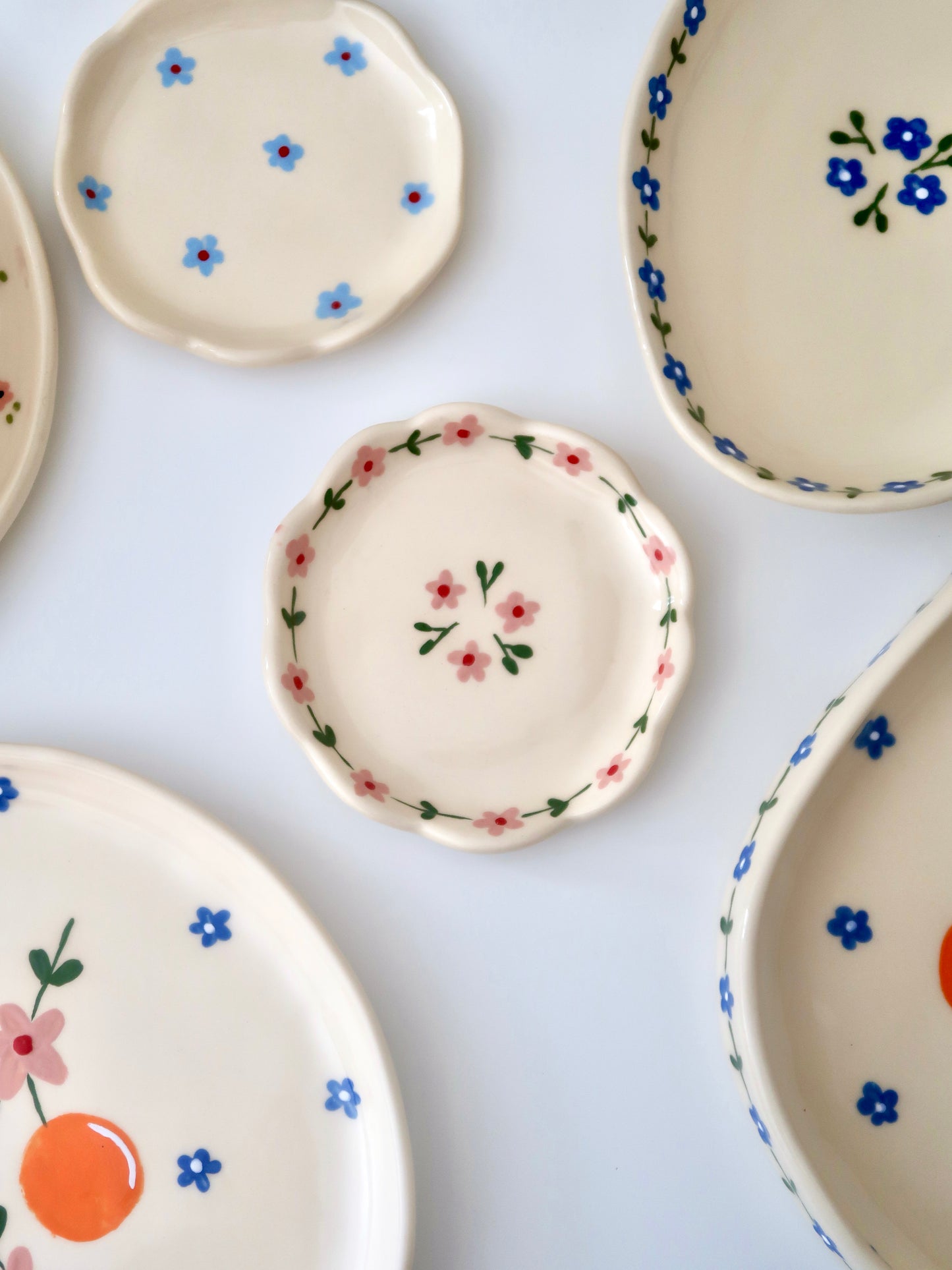 Scalloped ring dish with pink flowers