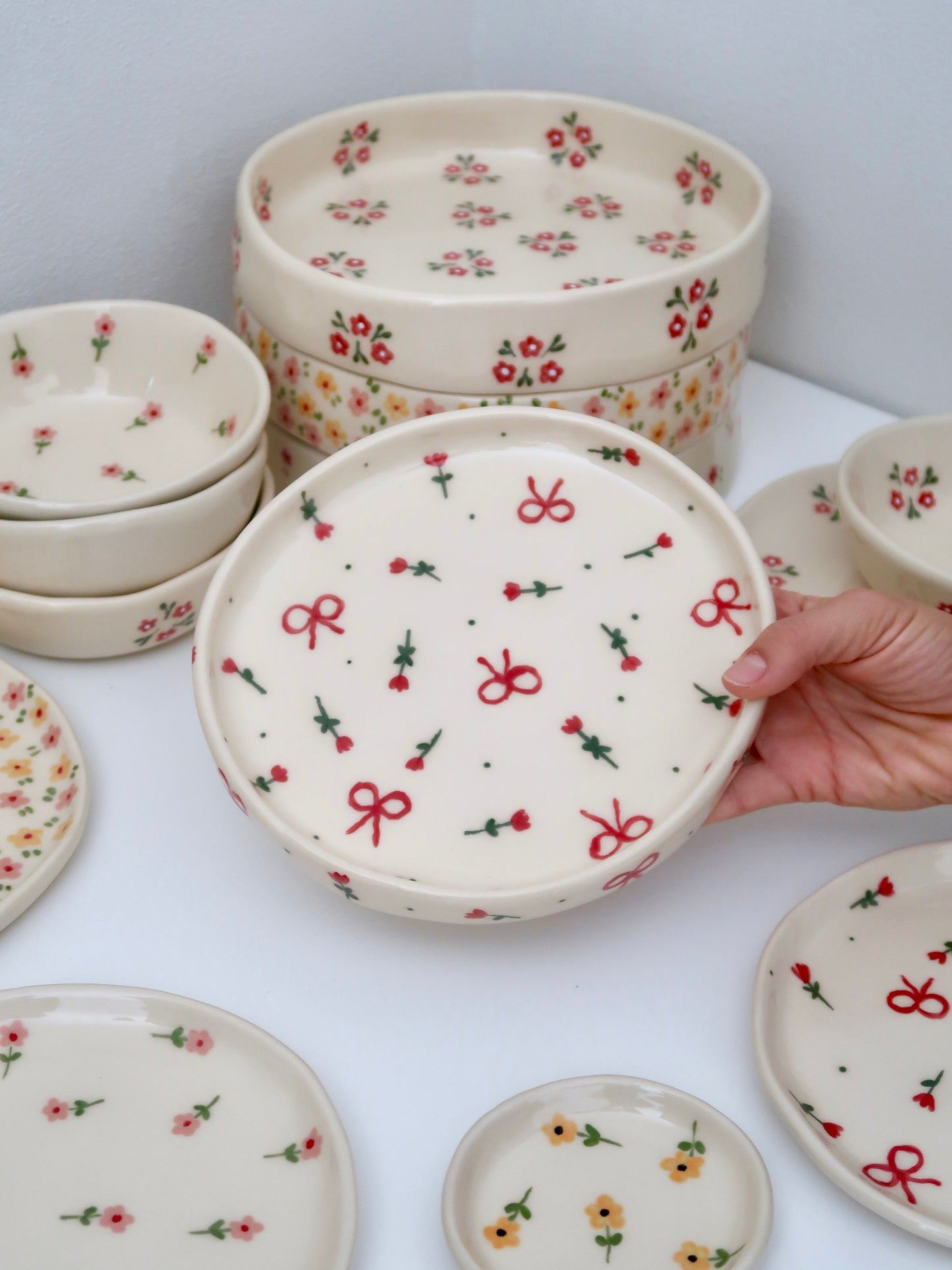 High edge plate with red flowers and bows
