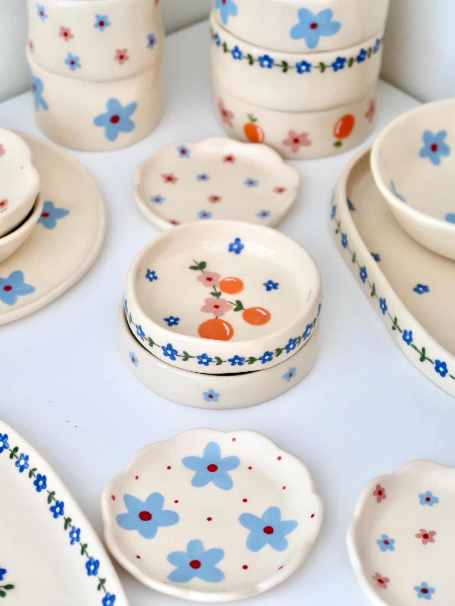 Ring dish with oranges and pink flowers