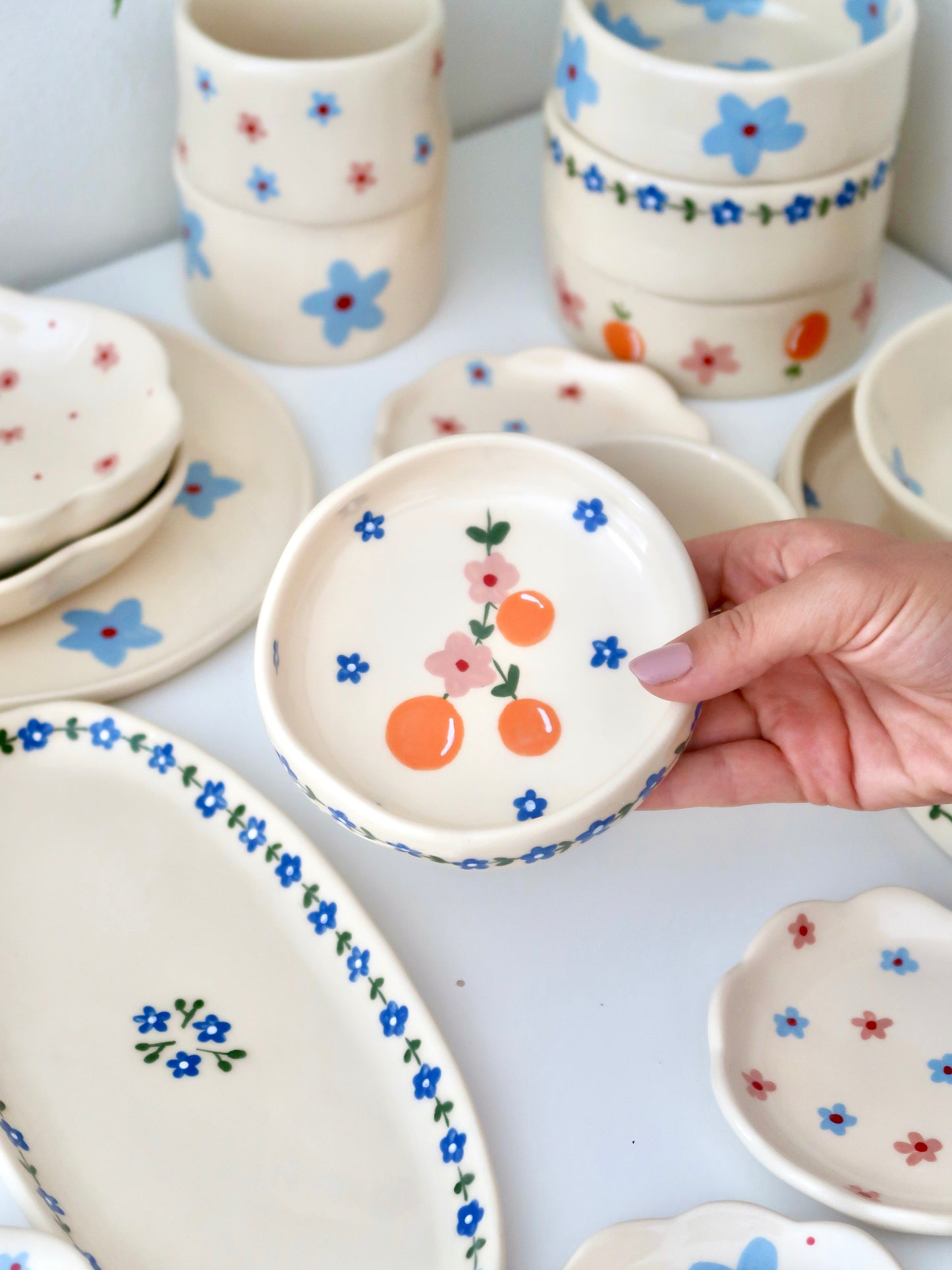 Ring dish with oranges and pink flowers