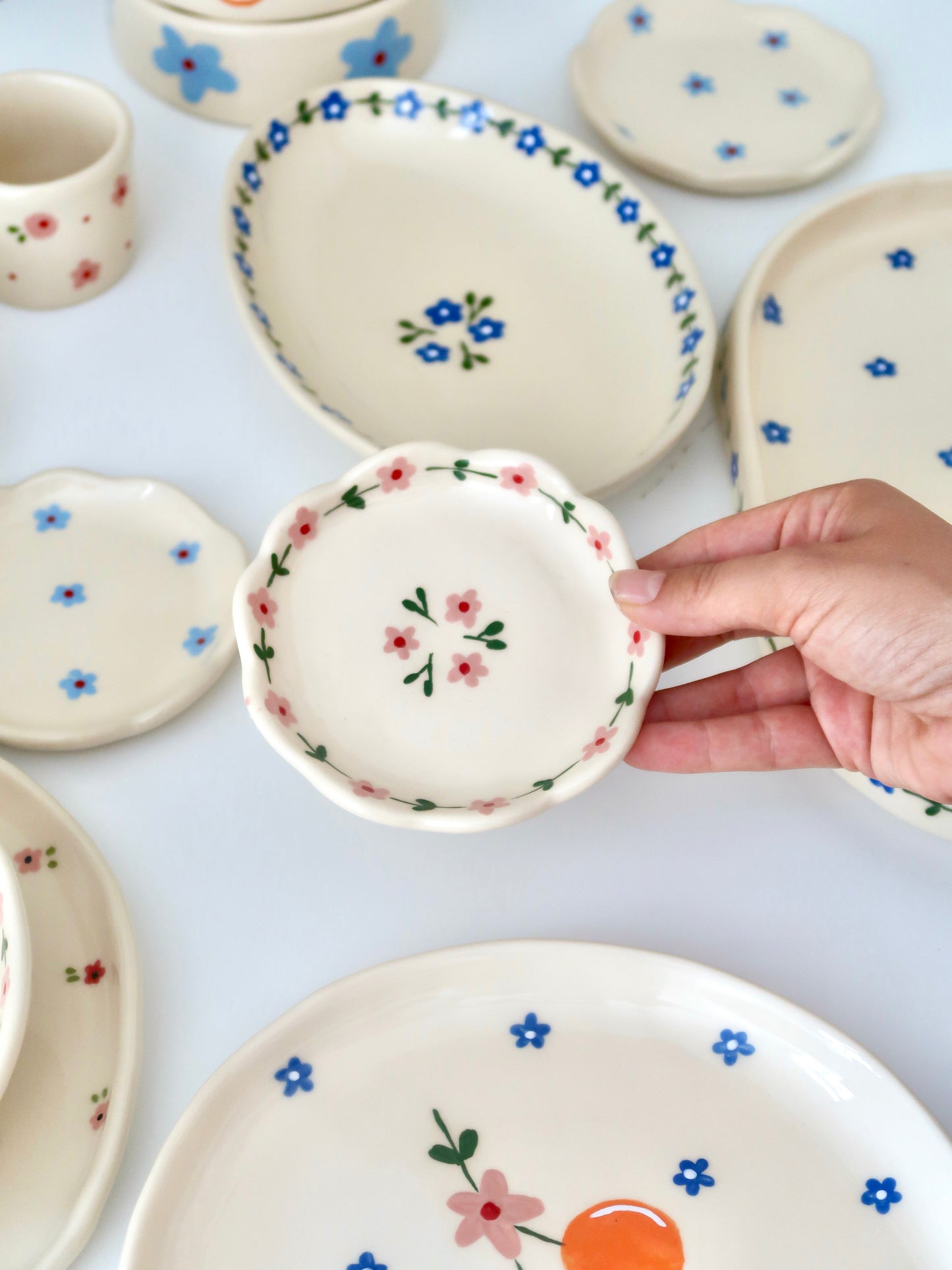Scalloped ring dish with pink flowers