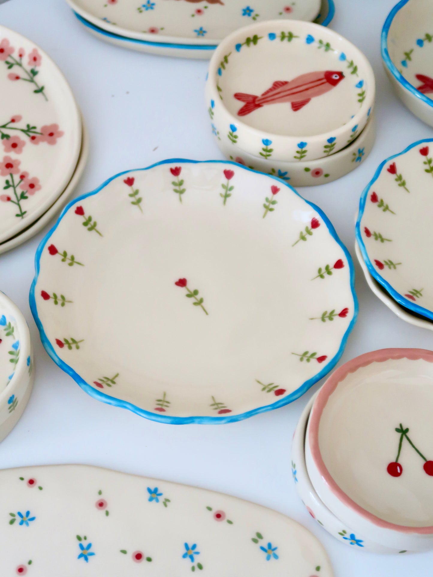 Scalloped plate with red flowers