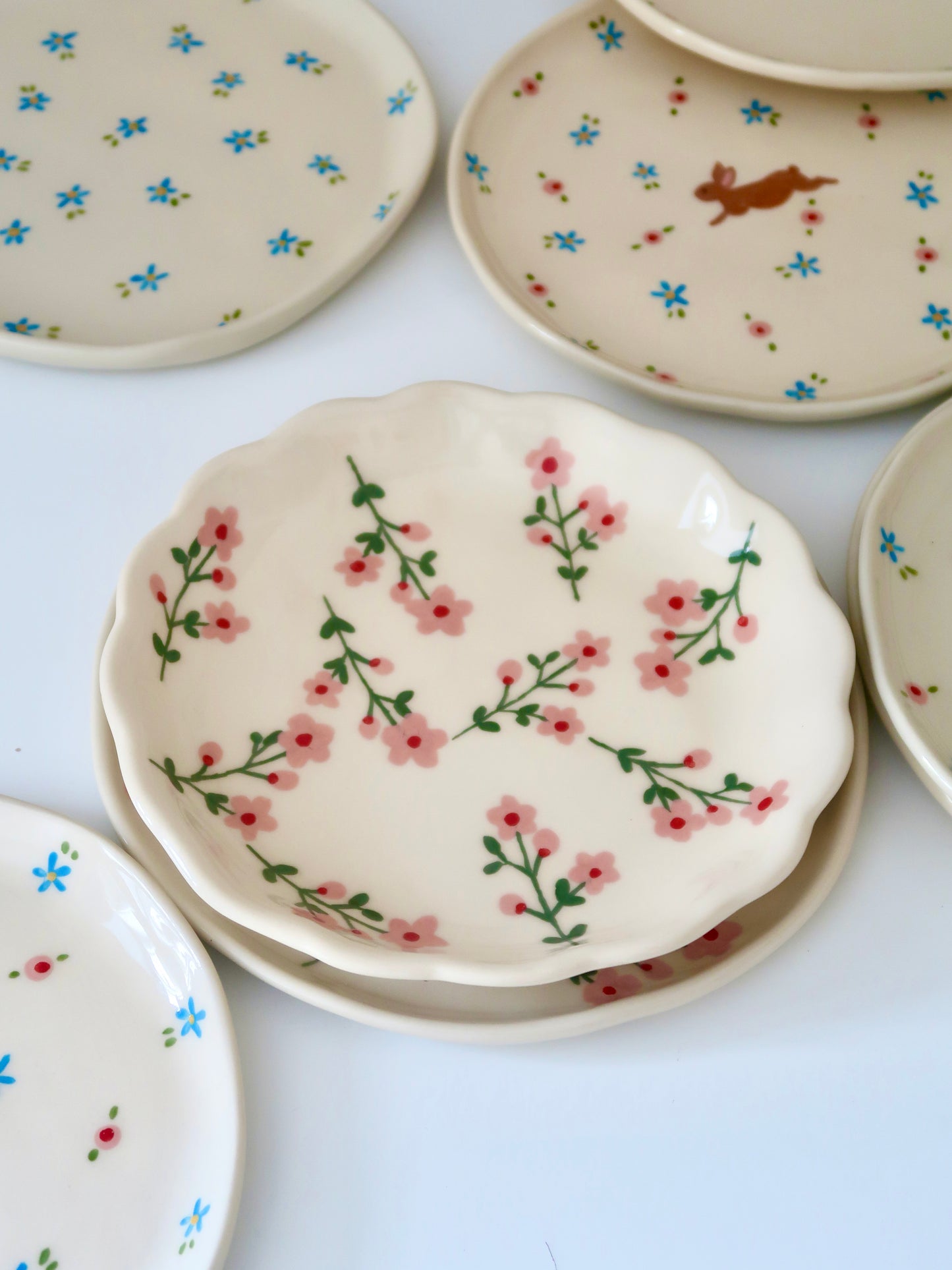 Scalloped plate with pink flowers