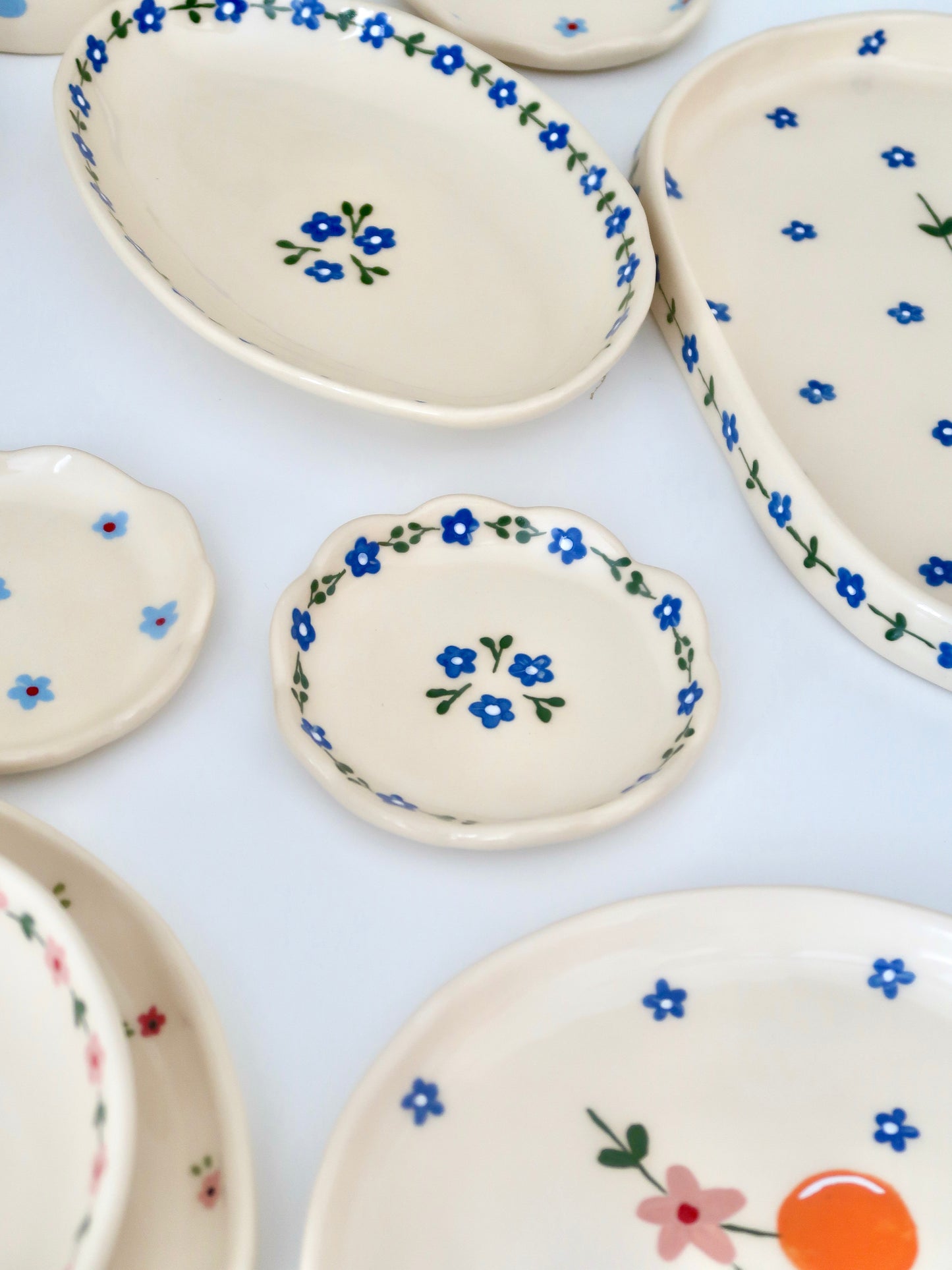 Scalloped ring dish with blue flowers