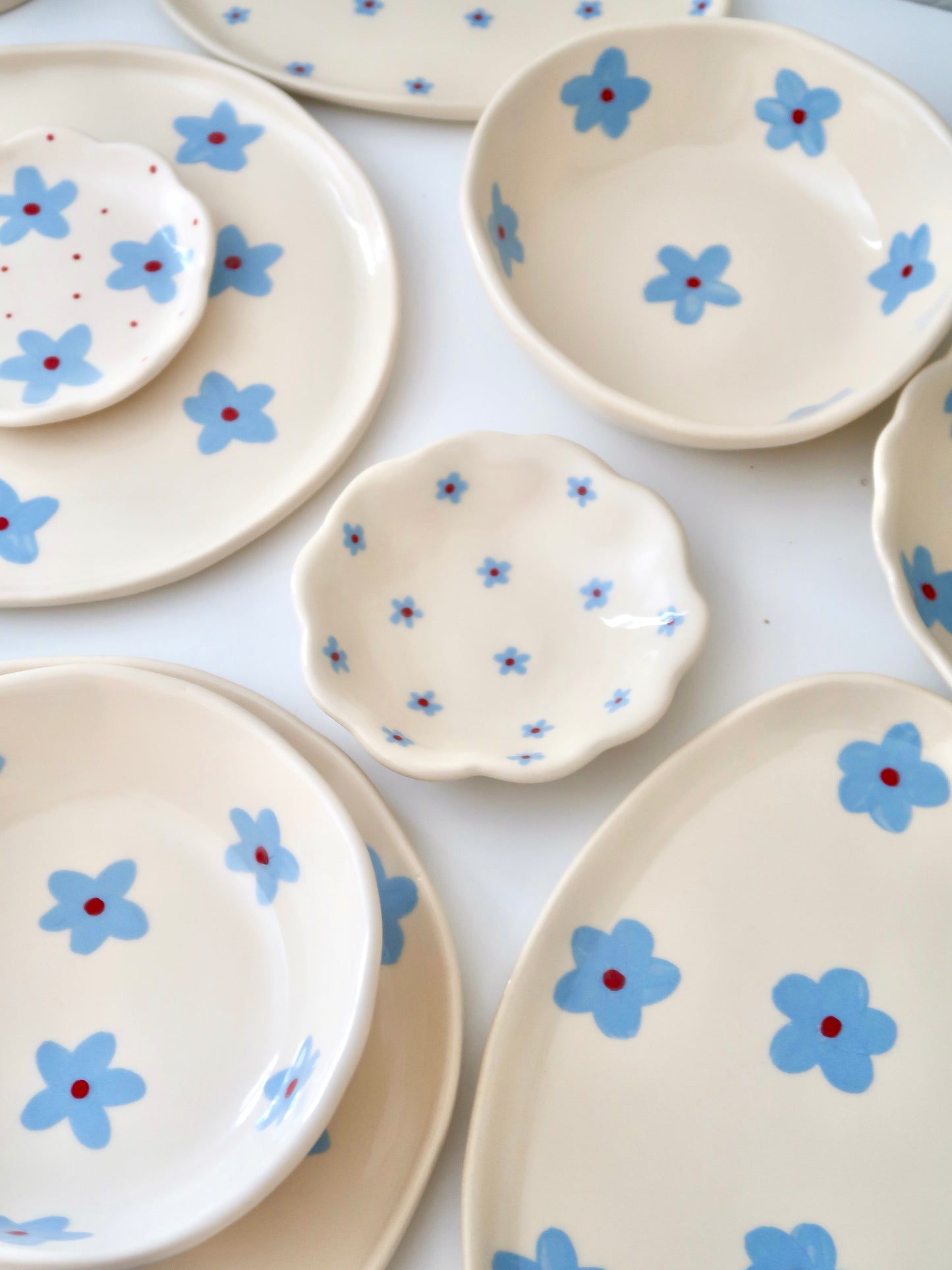 Scalloped ring dish with blue flowers