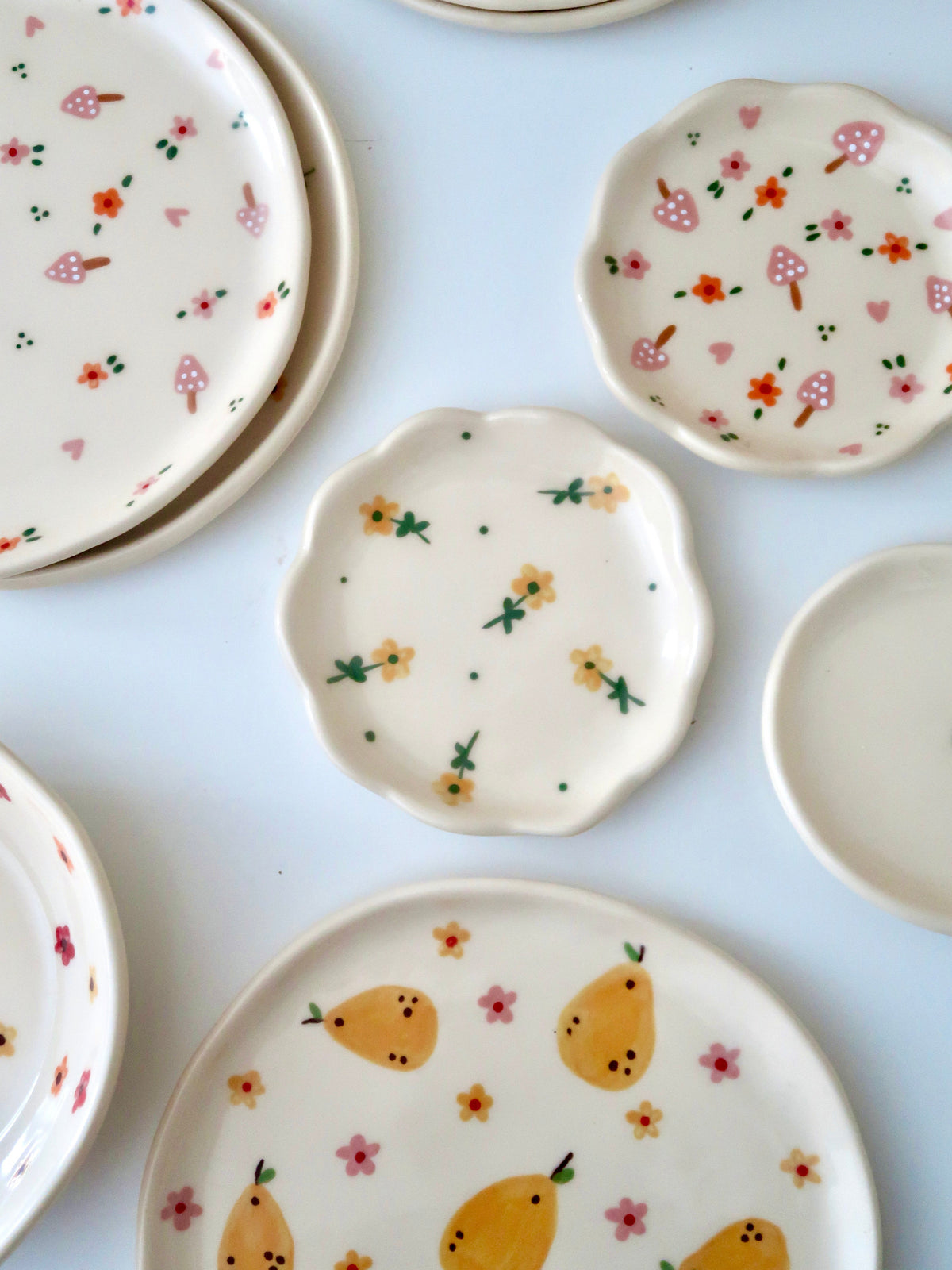 Scalloped ring dish with yellow flowers and green dots