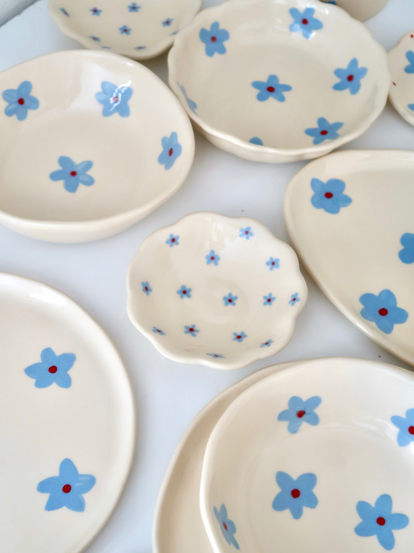 Scalloped ring dish with blue flowers