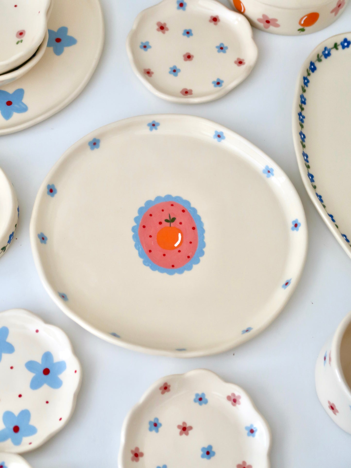 Plate with orange and blue flowers