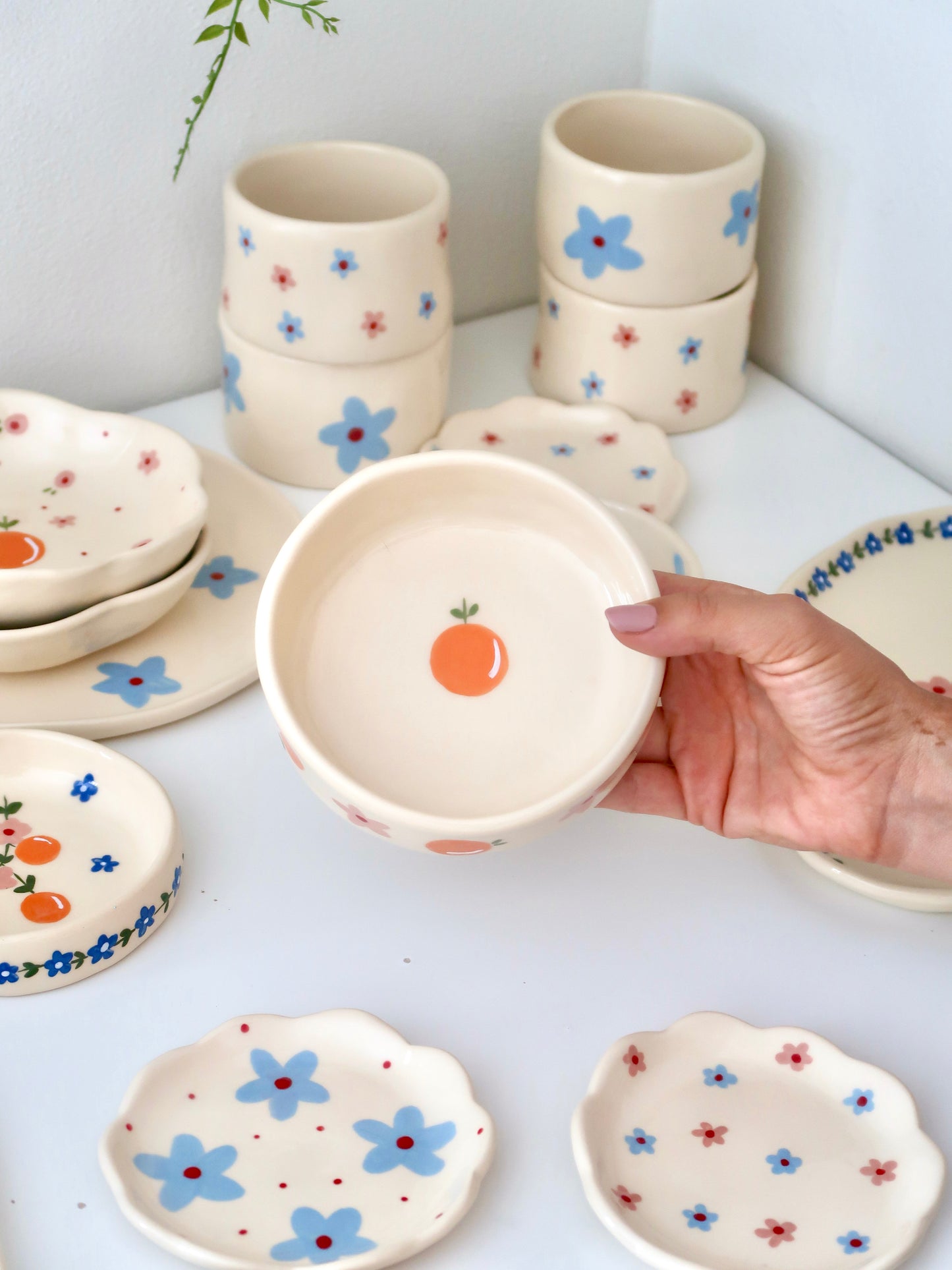 Bowl with oranges and blue flowers