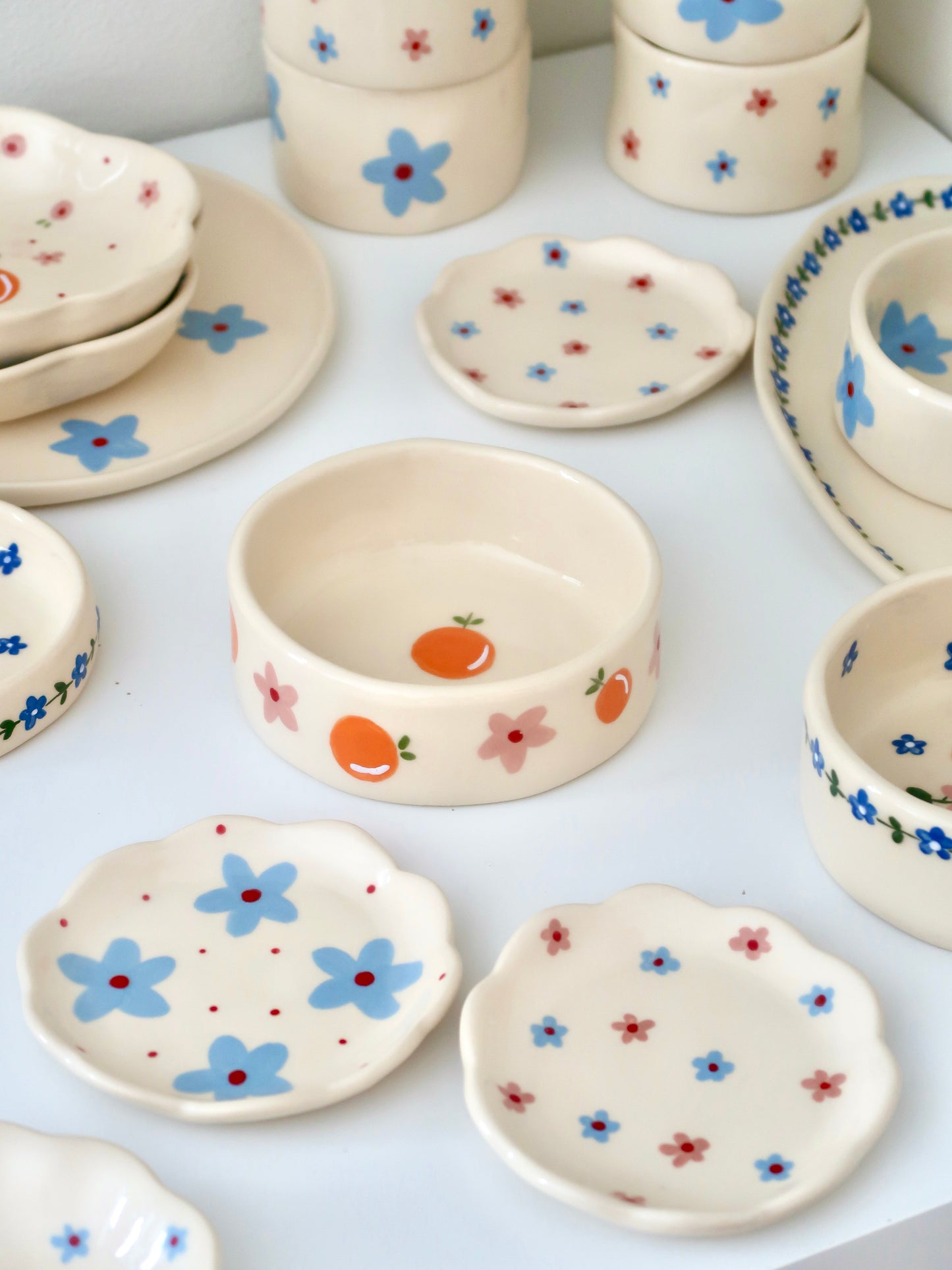 Bowl with oranges and blue flowers