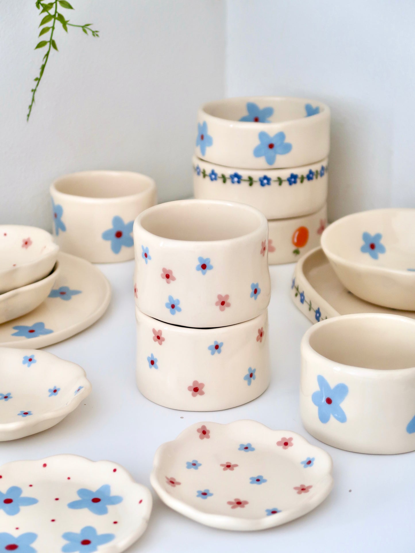 Small vase/ cup with pink and blue flowers