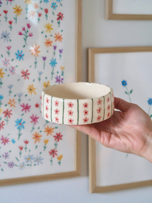 Bowl with pink flowers and green lines