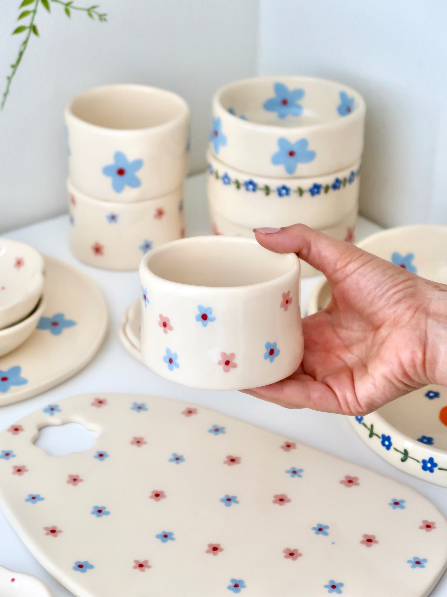 Small vase/ cup with pink and blue flowers