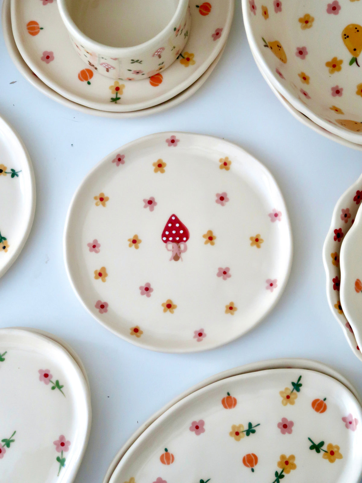 Breakfast/Dessert plate with a mushroom and pink and yellow flowers