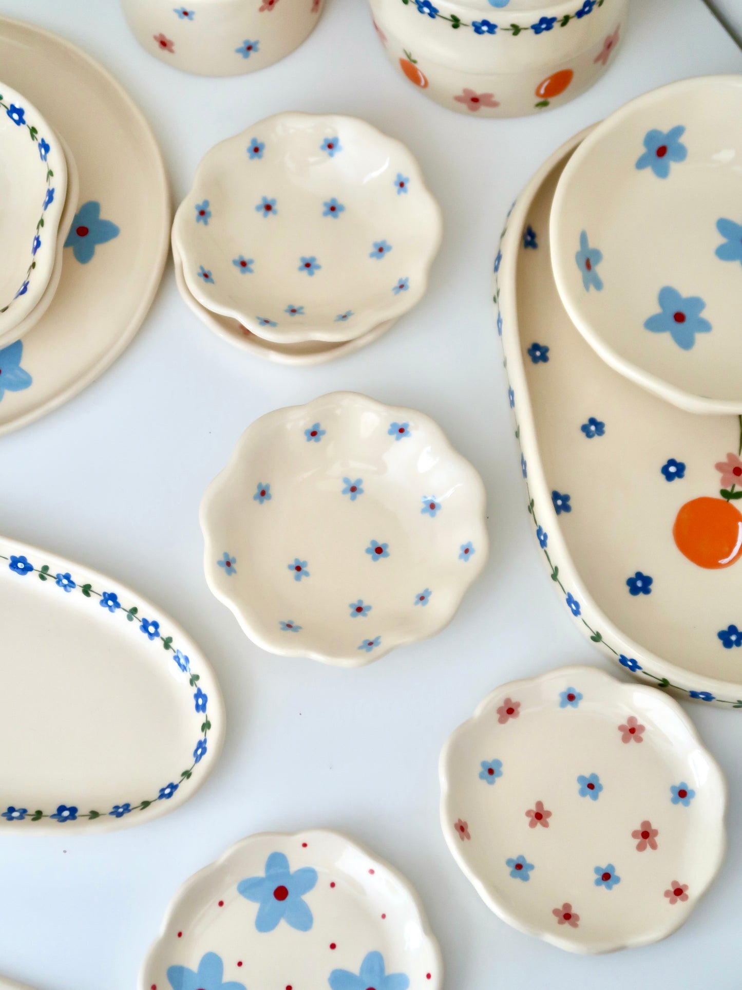 Scalloped ring dish with blue flowers