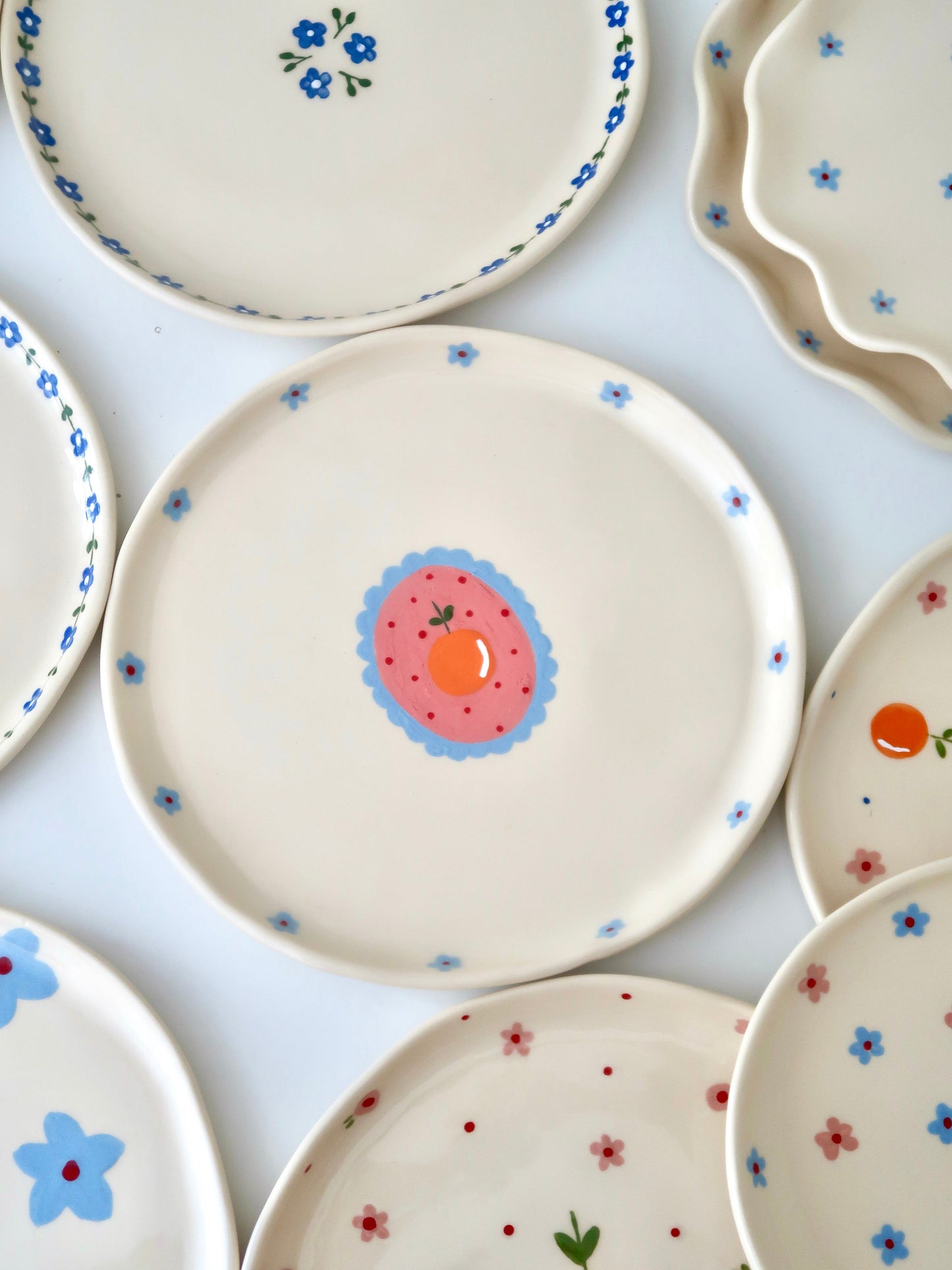 Plate with orange and blue flowers